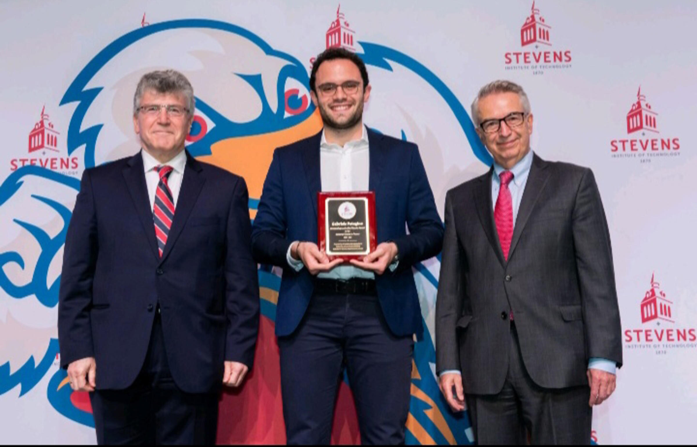 Emmanuel Hatzakis, Gabriele Petagine and Gregory Prastacos. Gabriele is in the middle holding his award.