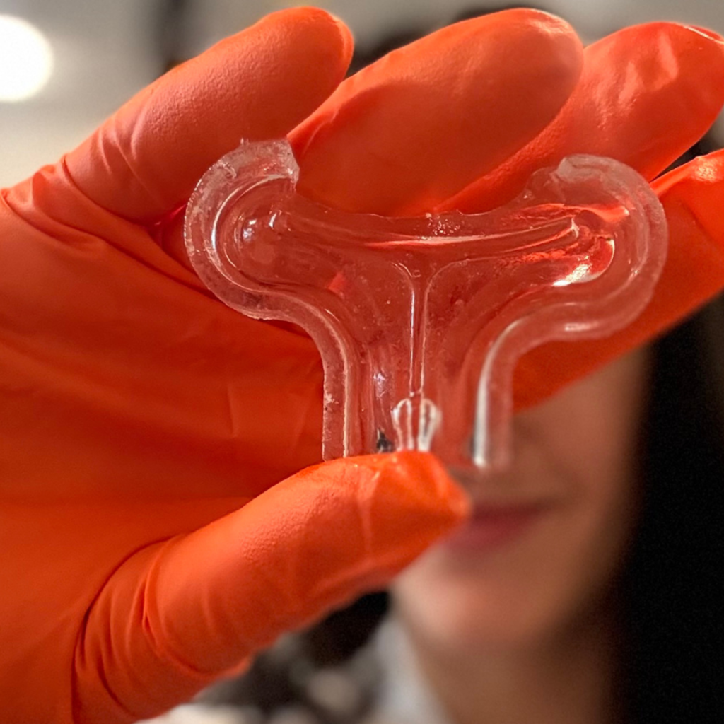 5 Biomedical Engineering students, Ujjwal Rameshwaram, Sophia Donskoy, Kaitlyn Tsai, Ruhi Ajinkya and Sanaiya Villanueva stand around their presentation poster, titled SensiTear: A Platform Revolutionizing Disease Diagnostics.