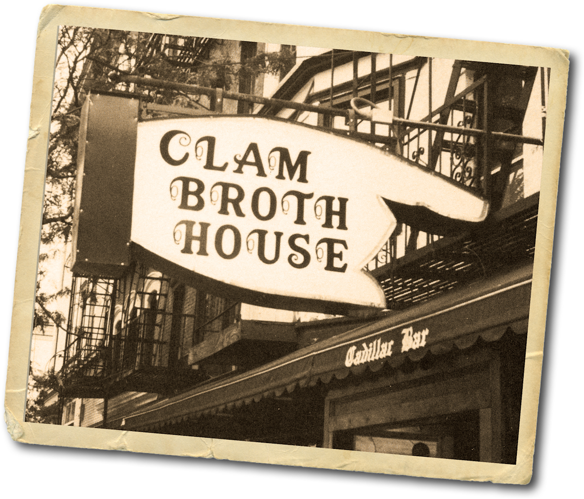 Clam Broth House restaurant, with a finger-shaped sign that reads “Clam Broth House.” 