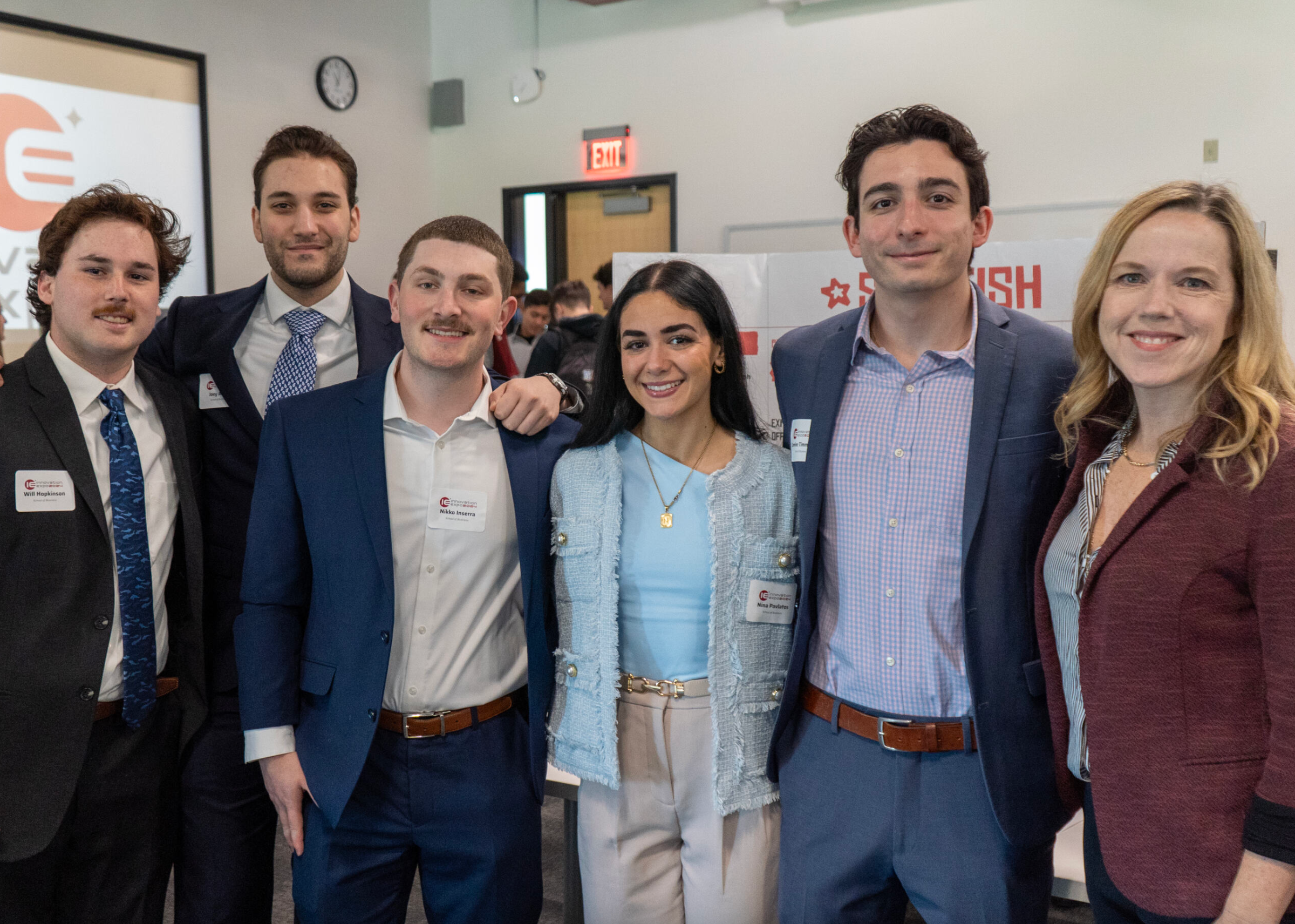 The members of the Starfish team stand in a straight line with faculty advisor Ann Murphy at the end.