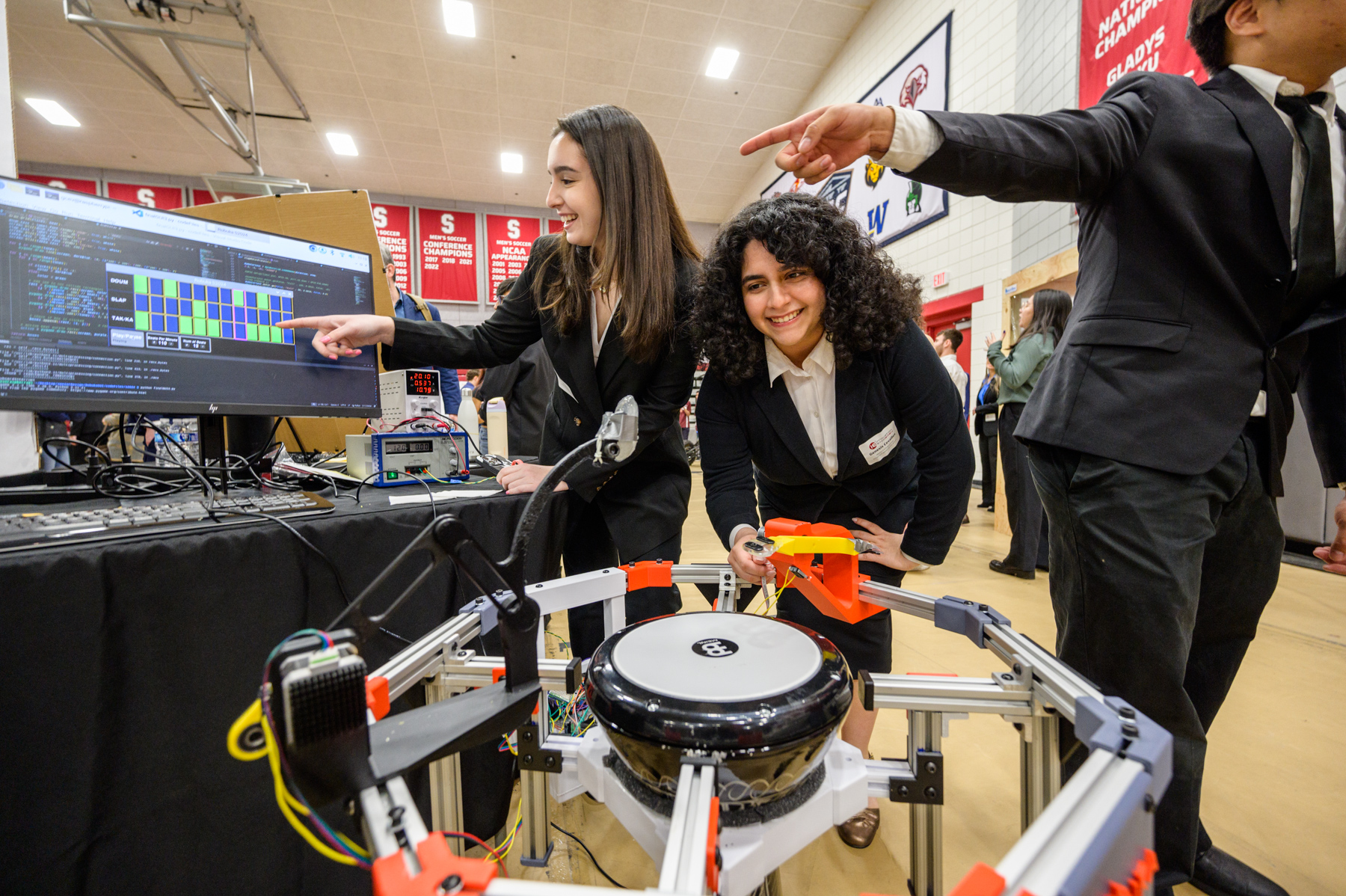 Students displaying a tech project in arena at 2024 Stevens Innovation Expo
