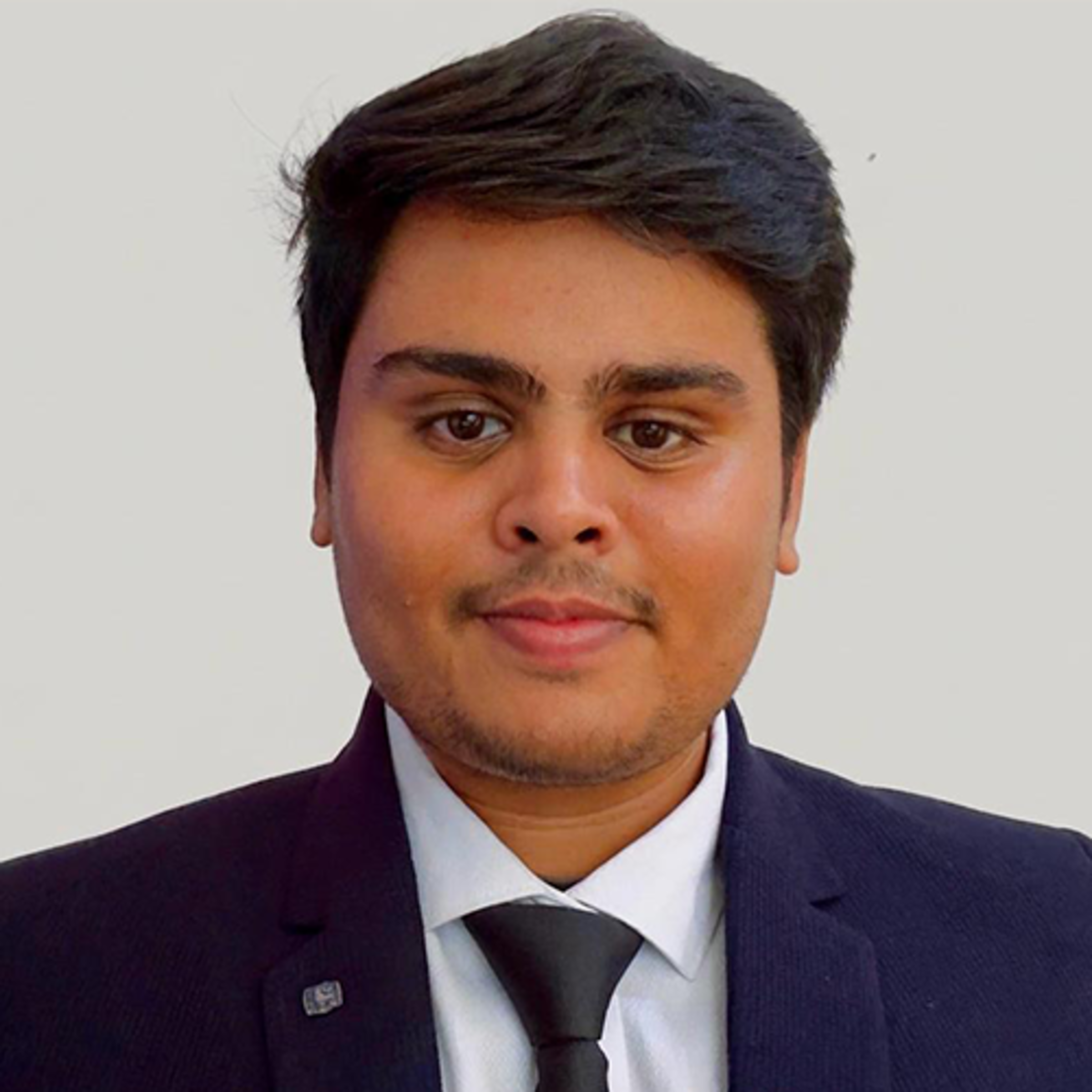 Headshot of Satvik Gurjar wearing business professional attire.