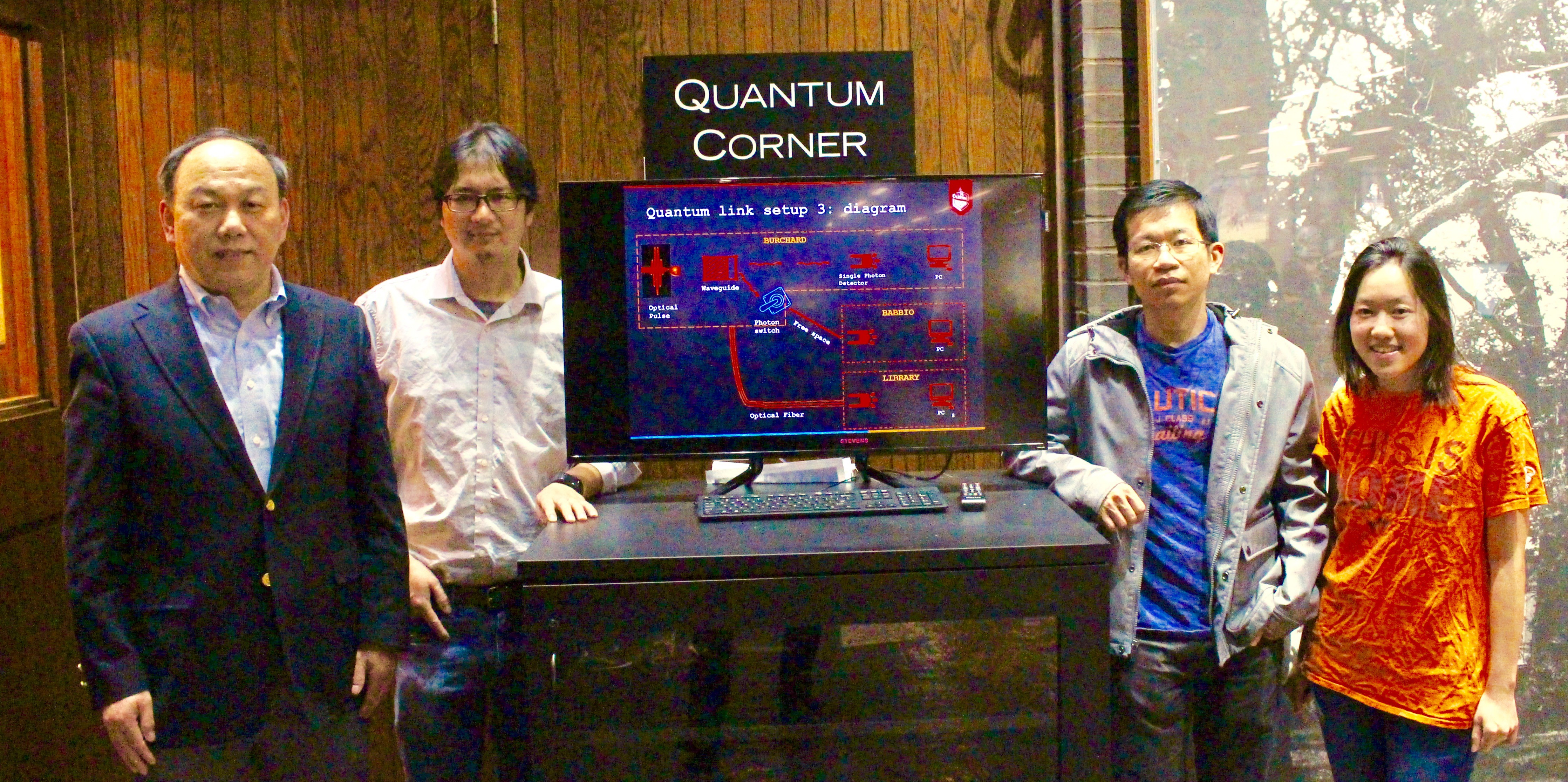 Physics faculty and students in the Stevens library