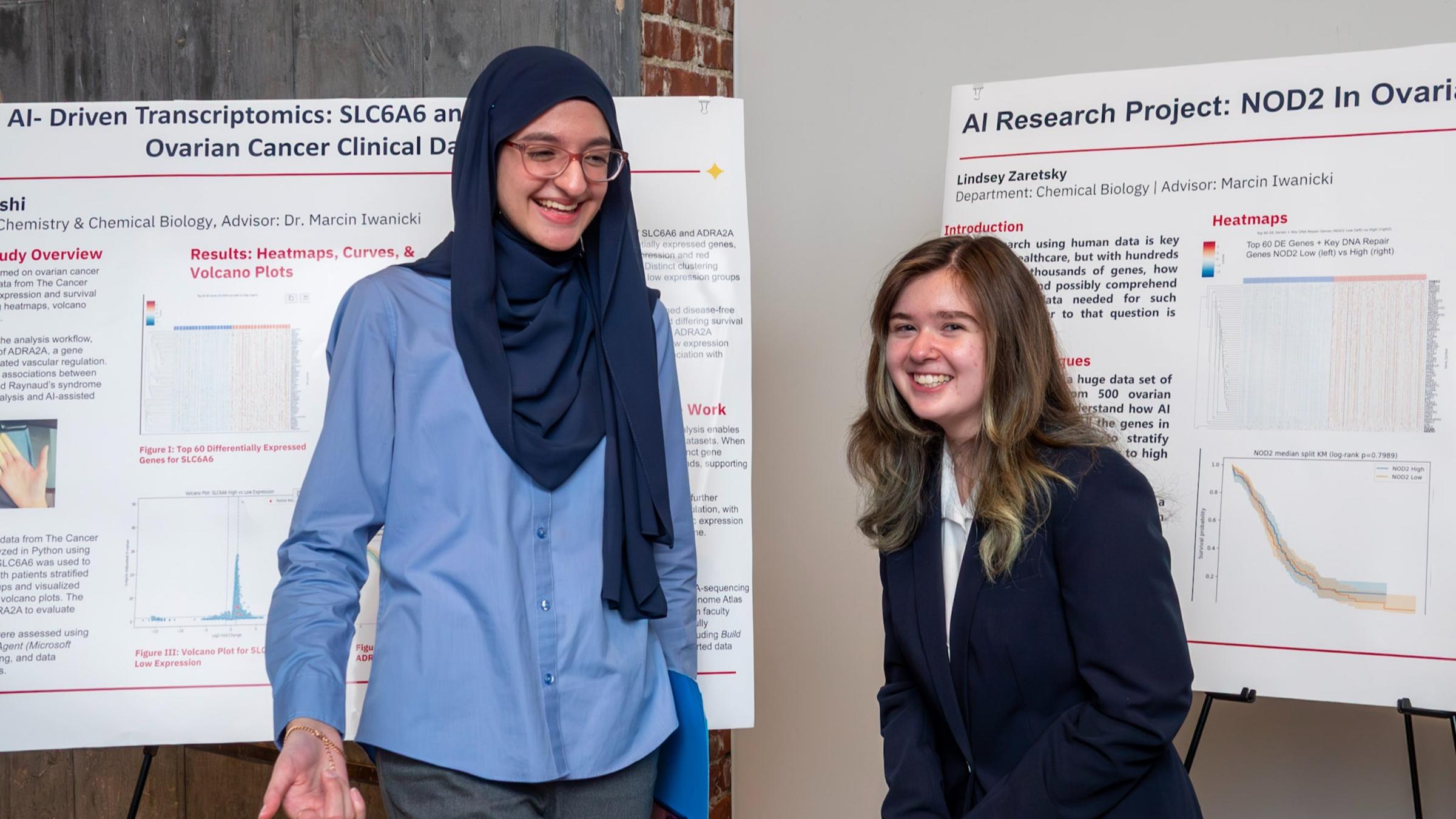 Two students wearing personal protective gear working in the newly renovated chemical biology laboratory..