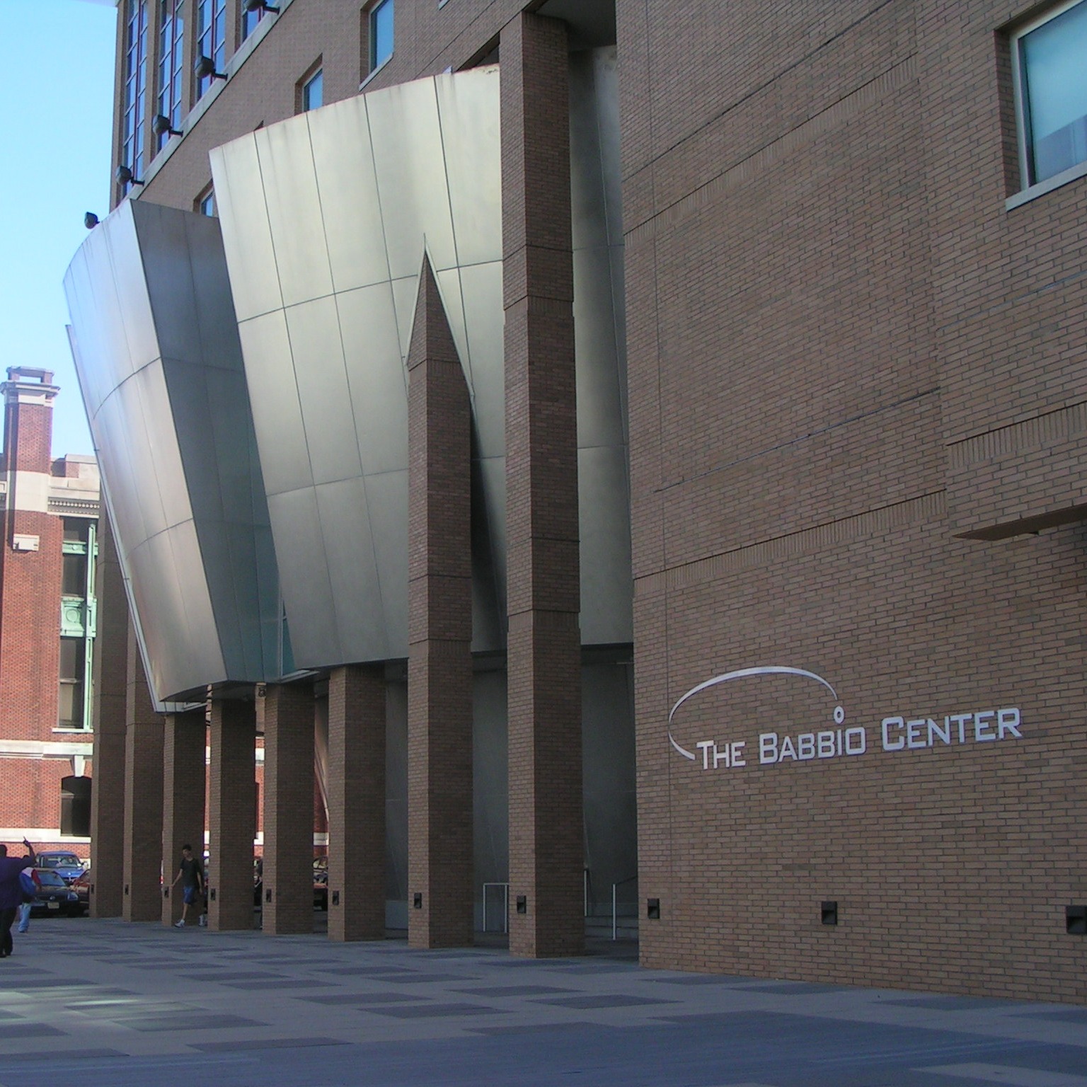 Exterior of the front of The Babbio Center, a modern looking brick building.