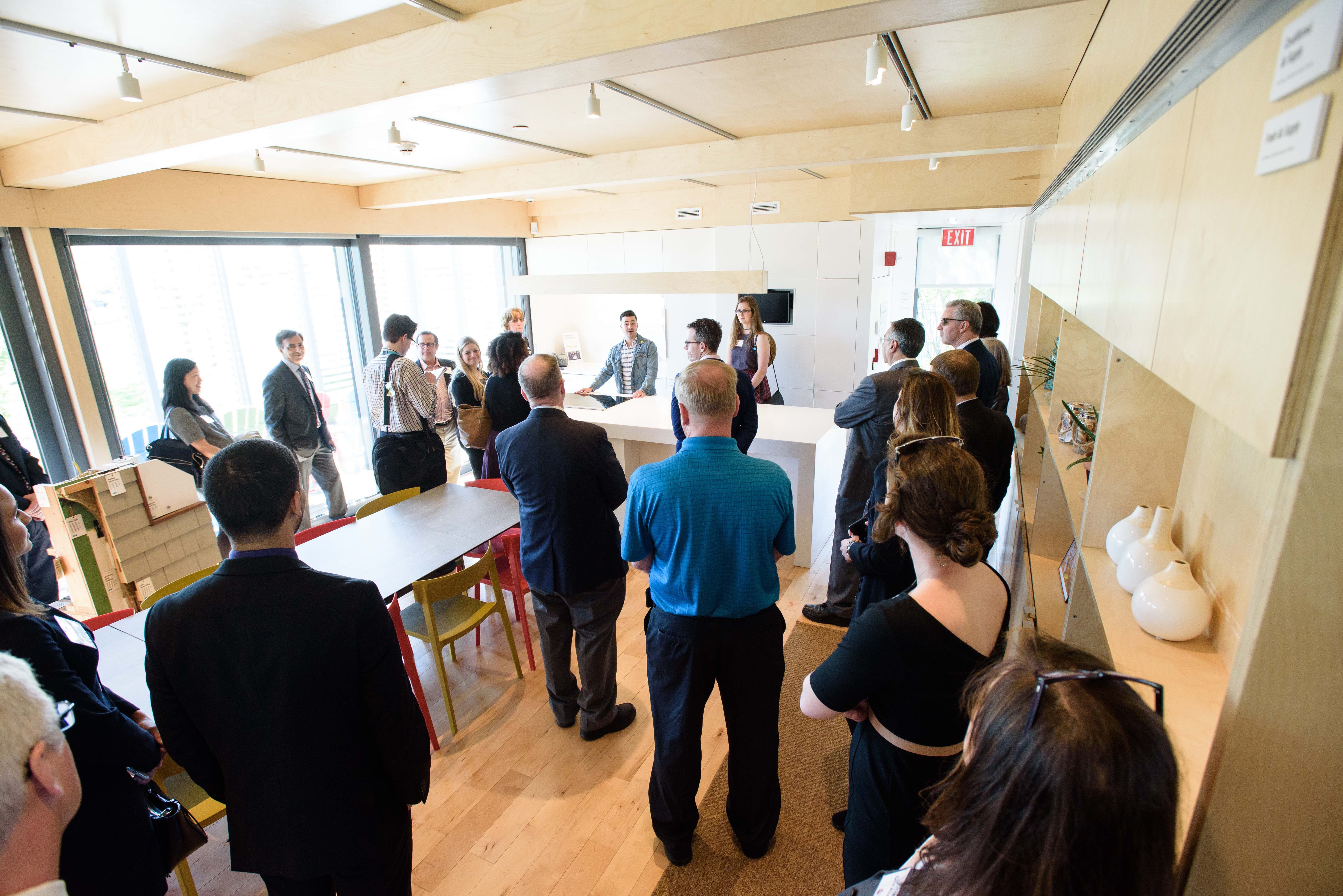 Members of the Stevens and PSEG communities tour the award-winning SU+RE House at Liberty Science Center. CREDIT: Jeff Vock.