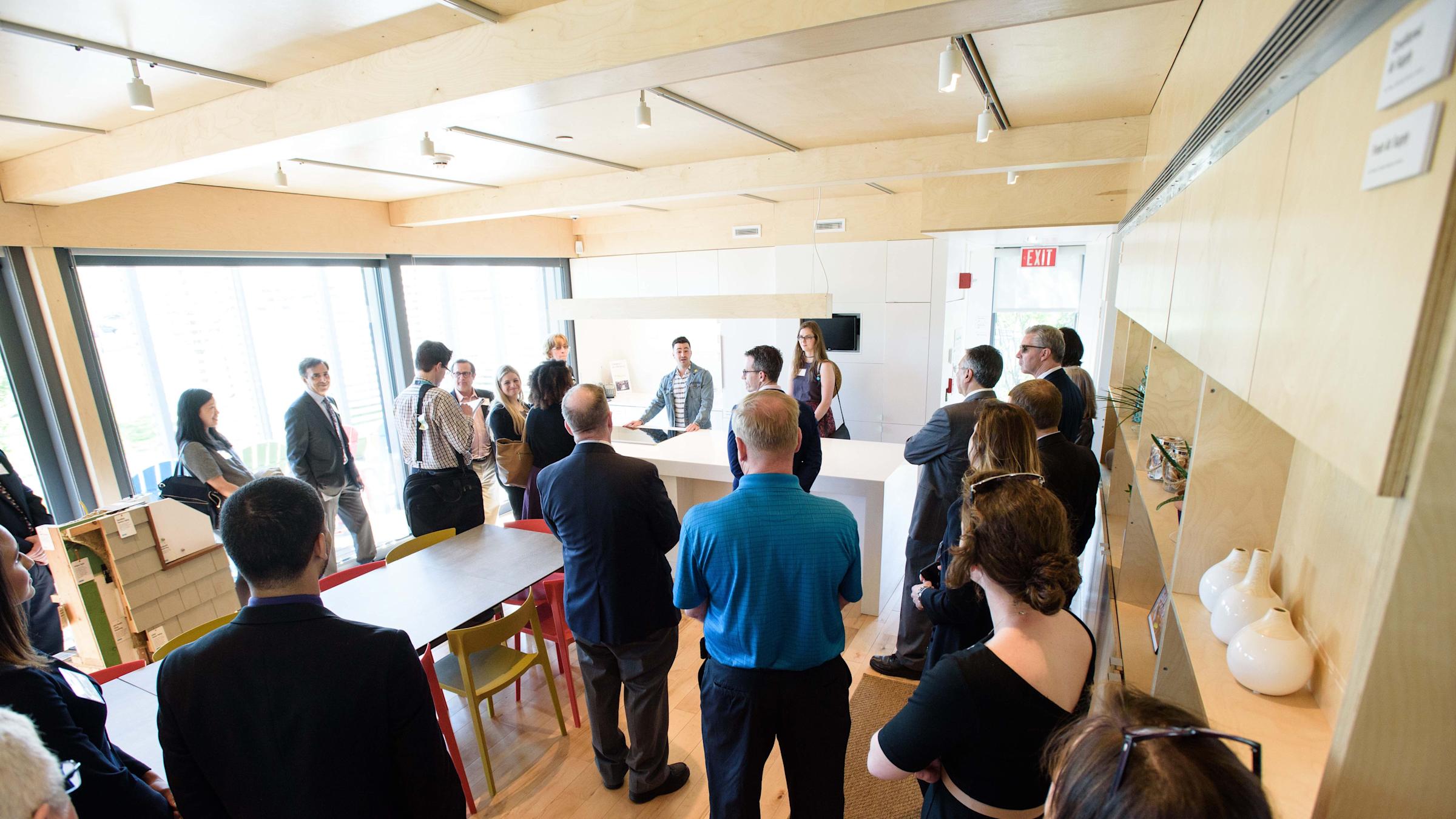 Members of the Stevens and PSEG communities tour the award-winning SU+RE House at Liberty Science Center. CREDIT: Jeff Vock.