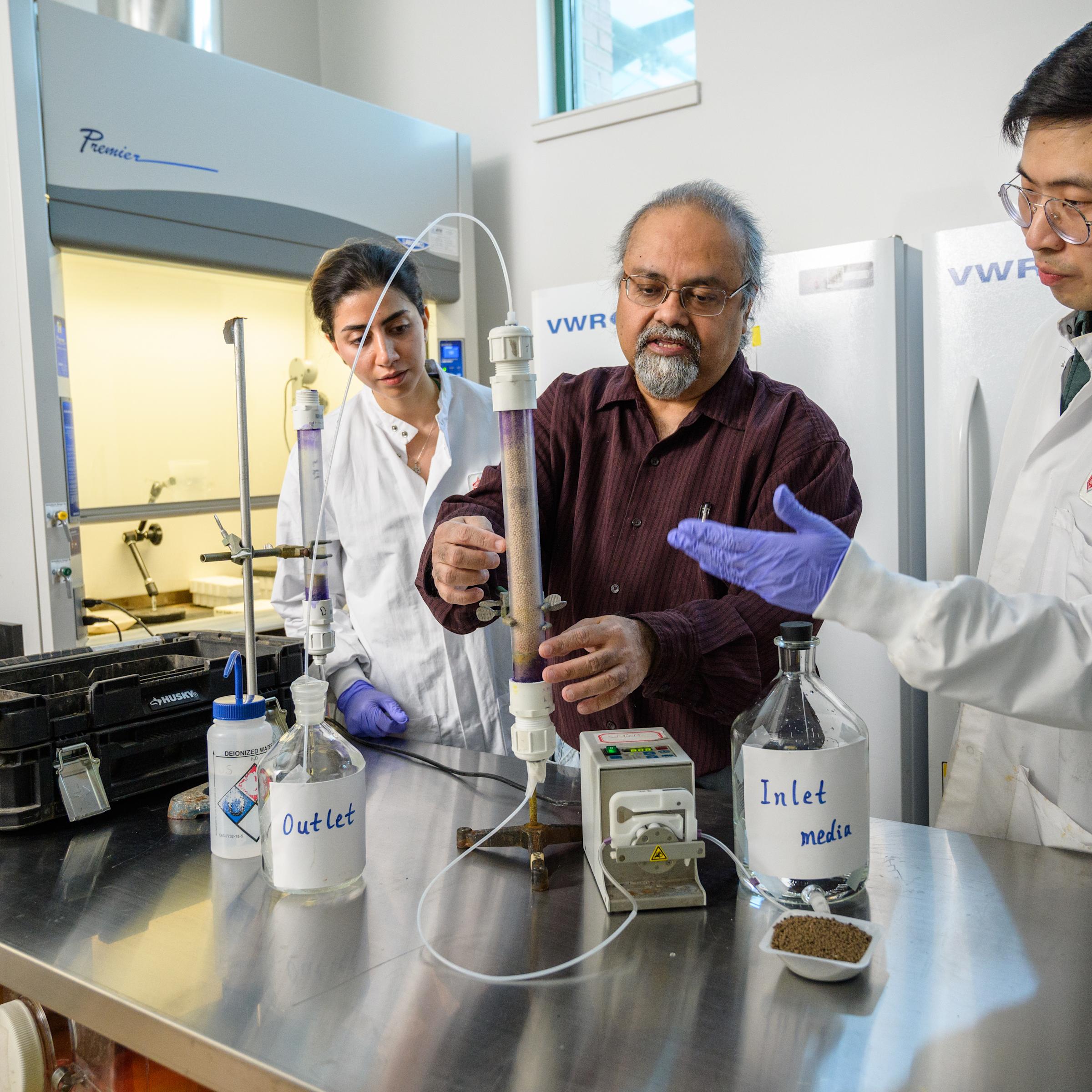 Dibs Sarkar with two grad students in the lab