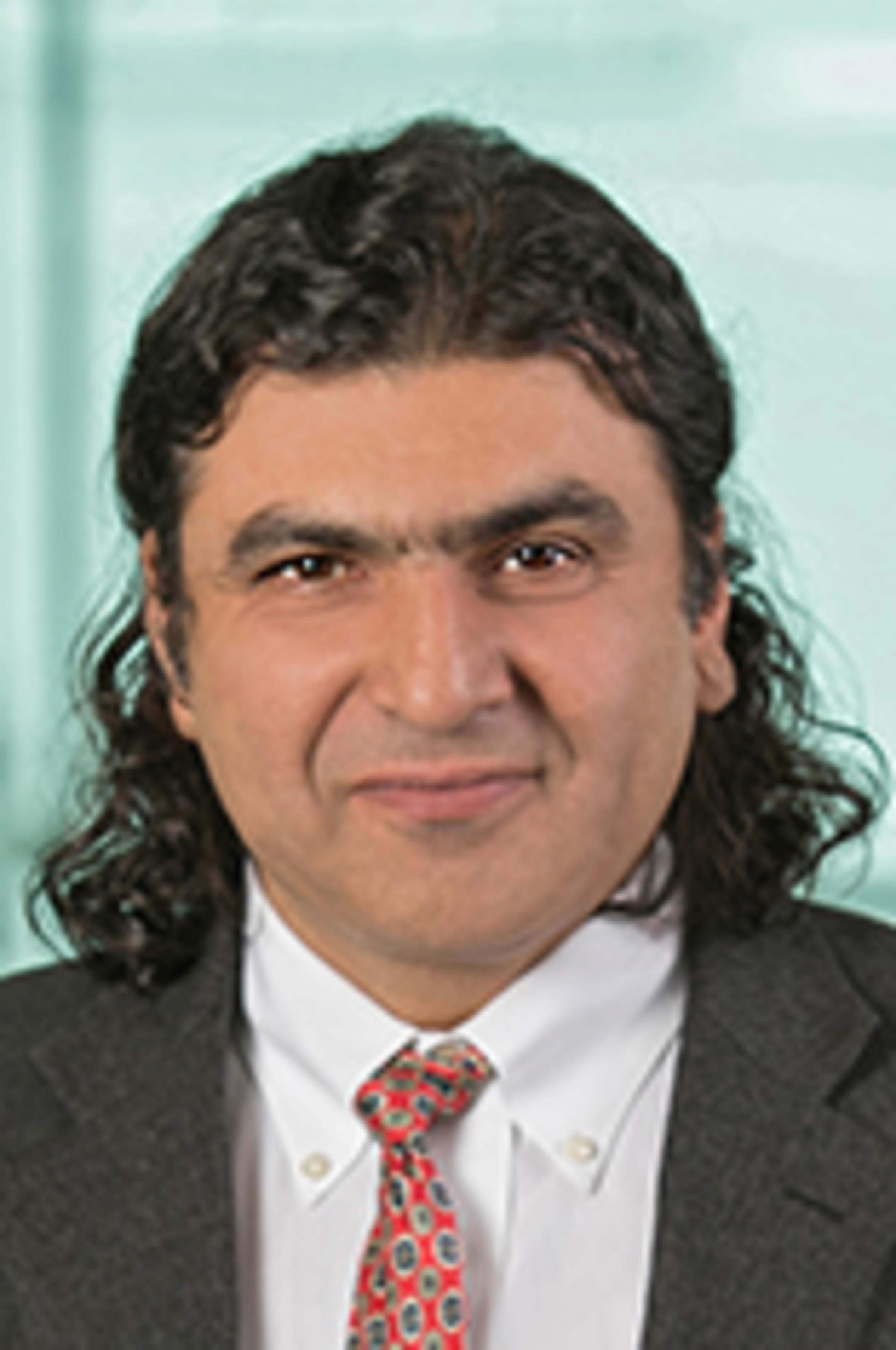 Headshot of Ionut Florescu with Manhattan in the background.