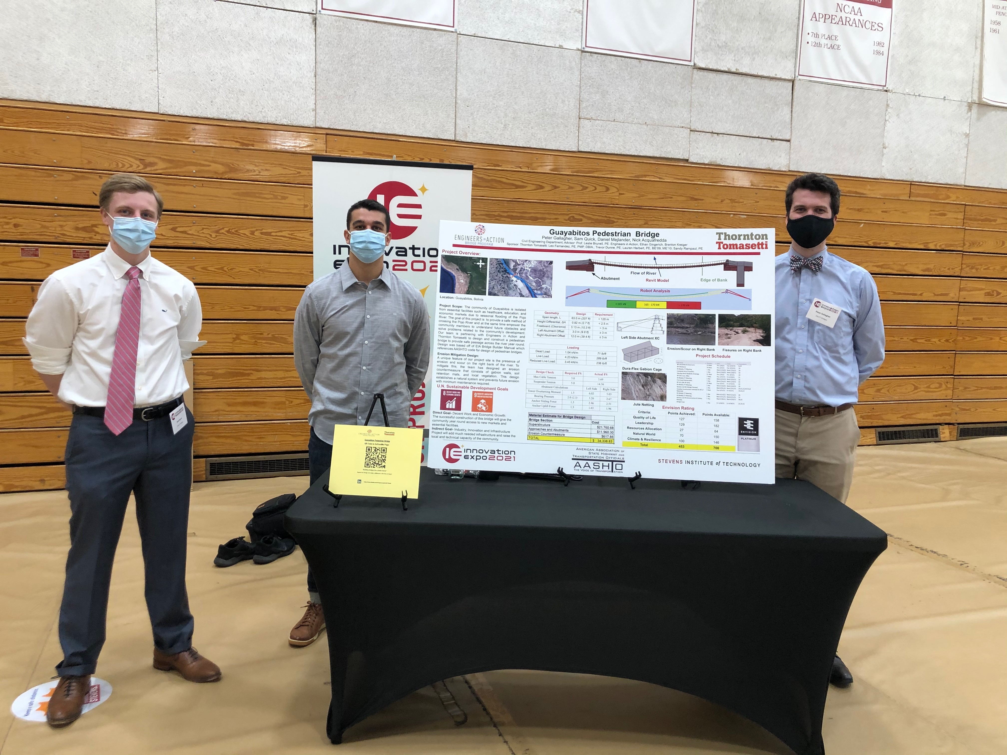 students with poster at Innovation Expo