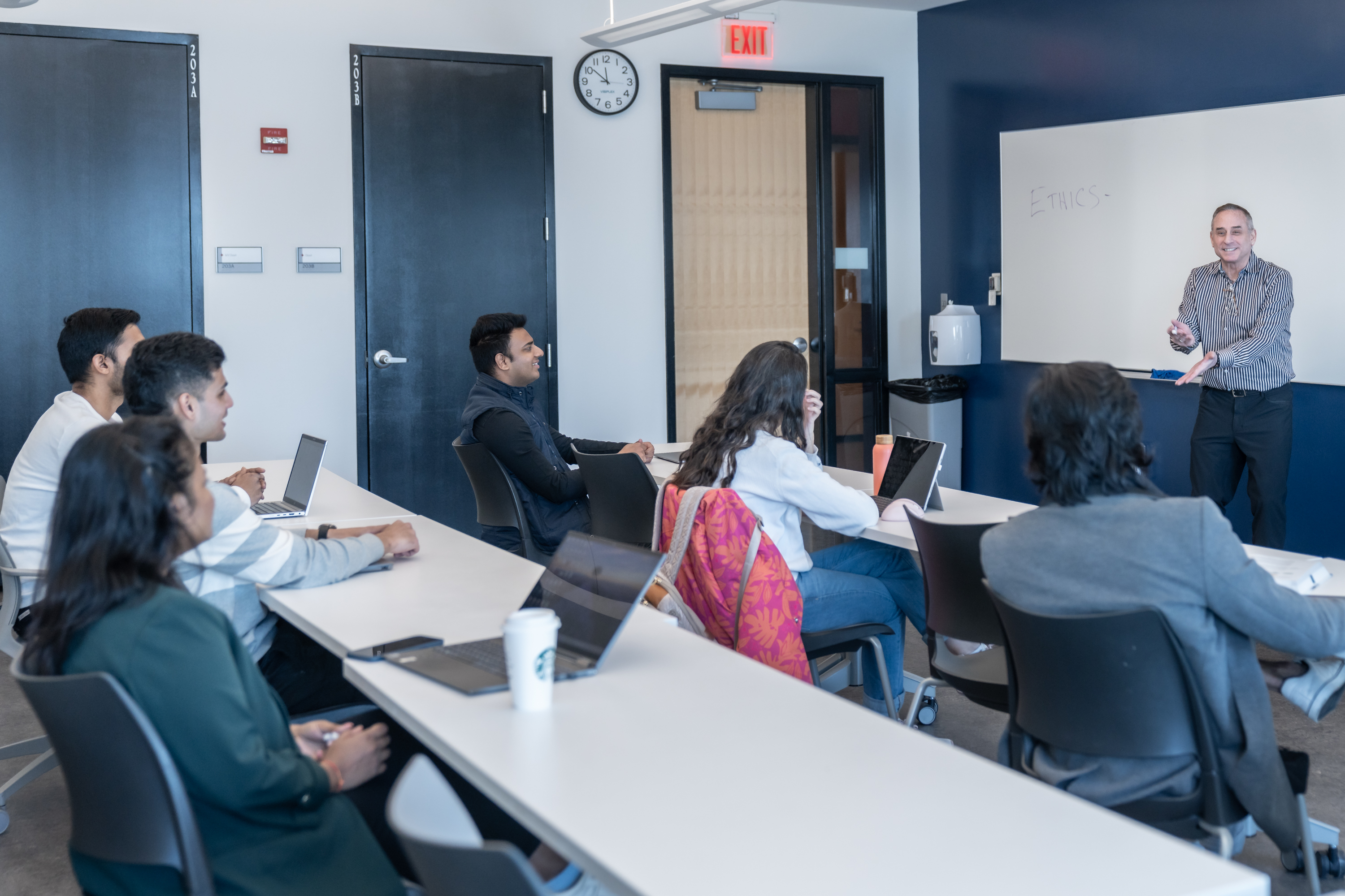 Professor Rothschild teaching students in a classroom