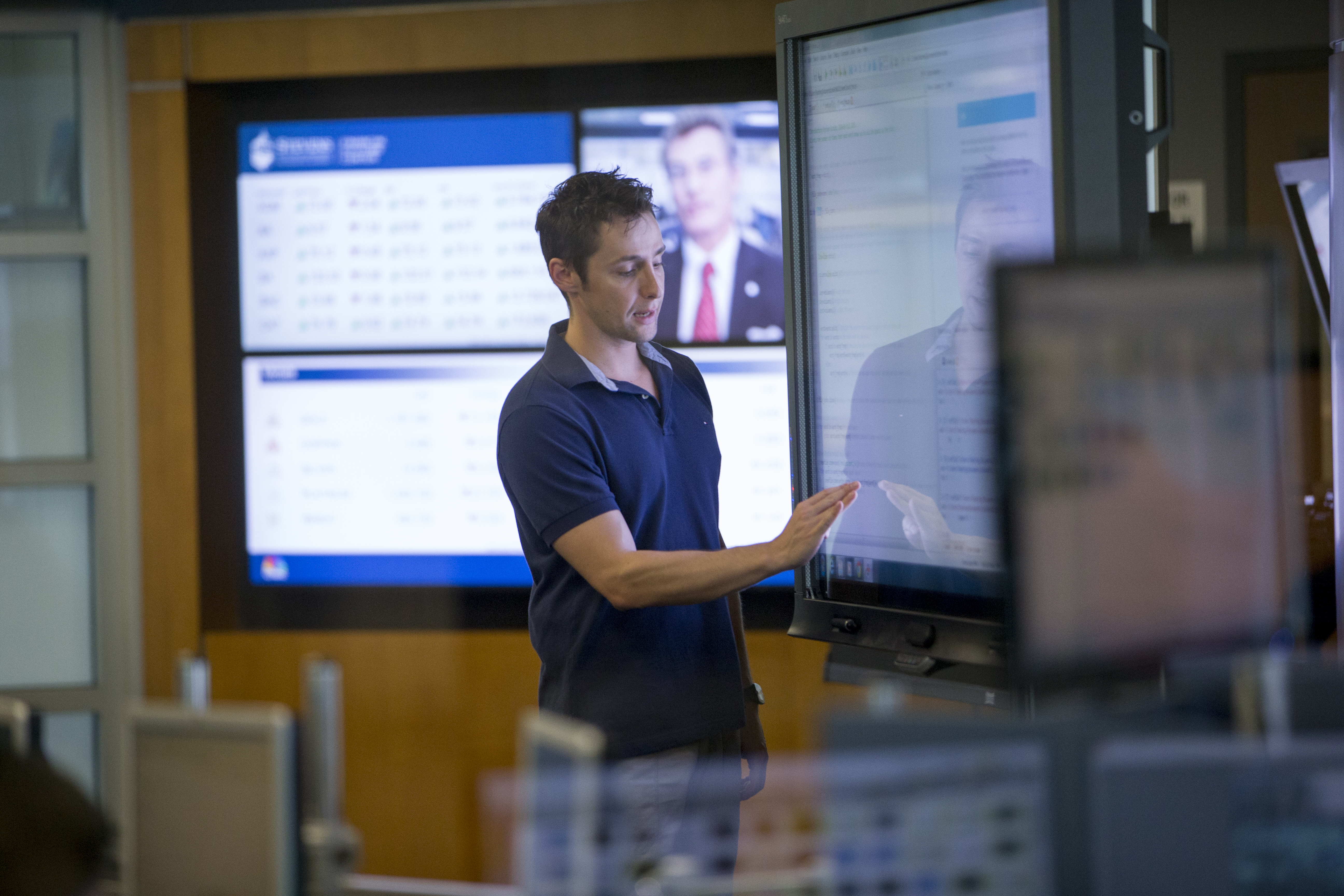 professor touching screen at Hanlon Lab