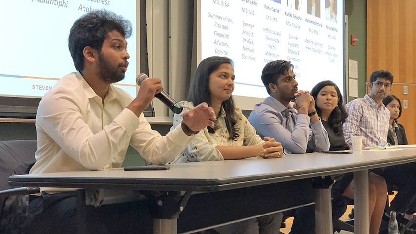 Three men and three women answer questions from the audience.