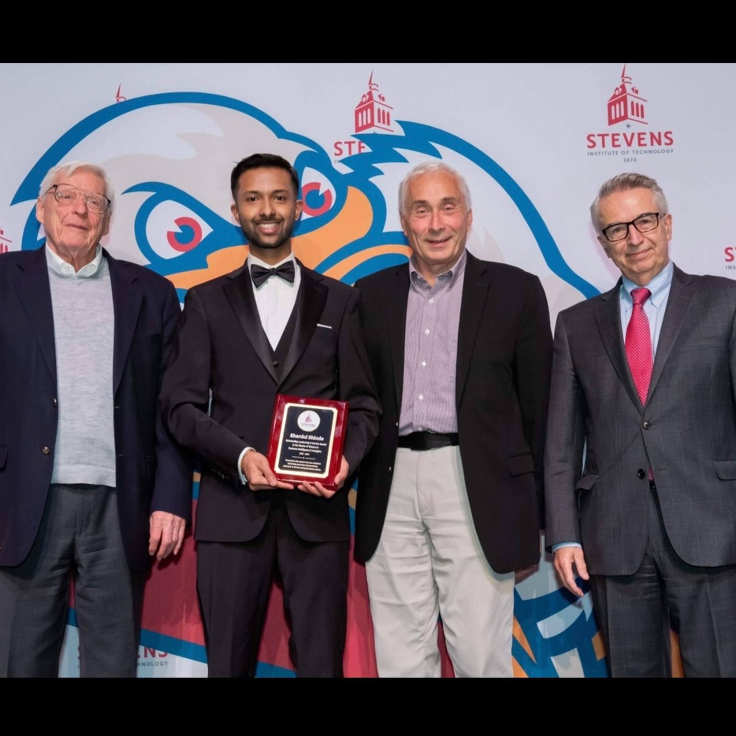 Shardul Shinde receives the Oustanding Leadership and Service Award at the 2022 awards gala.