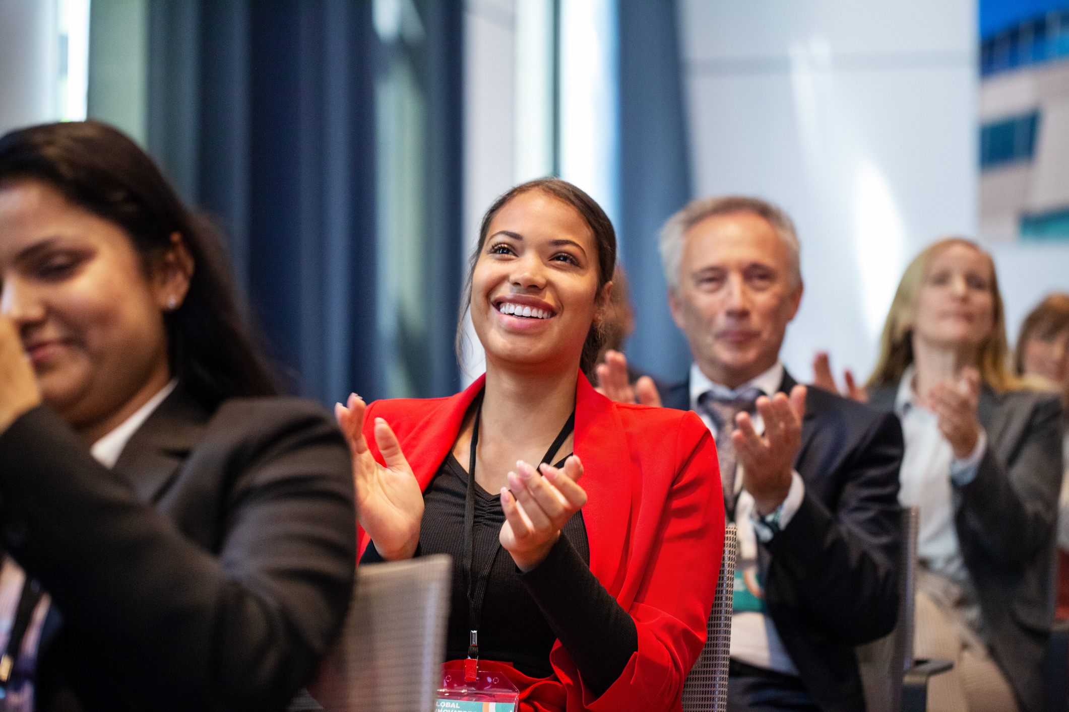 smiling business woman in red suit 