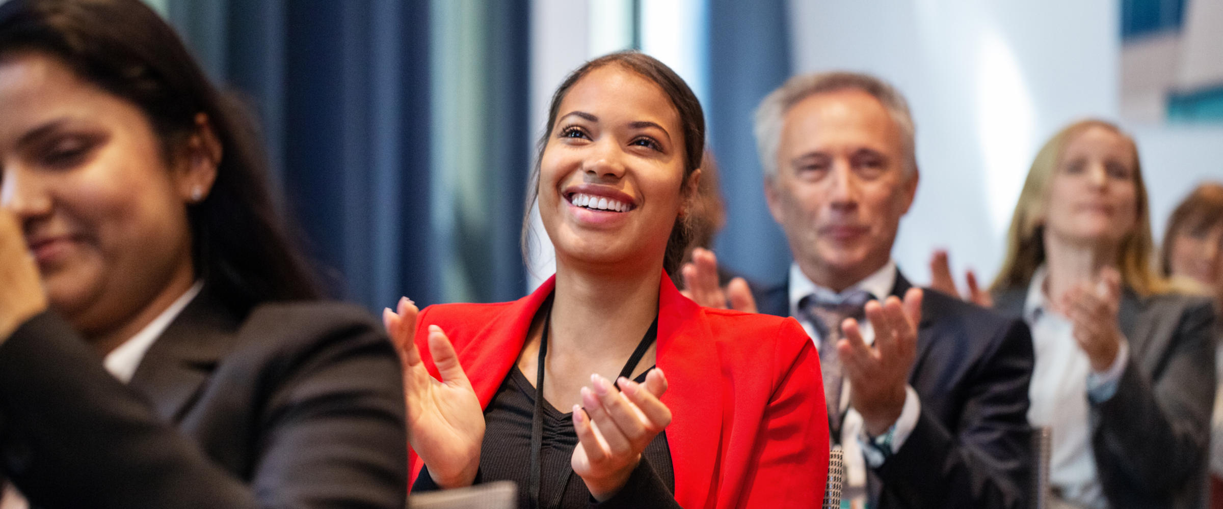 smiling business woman in red suit
