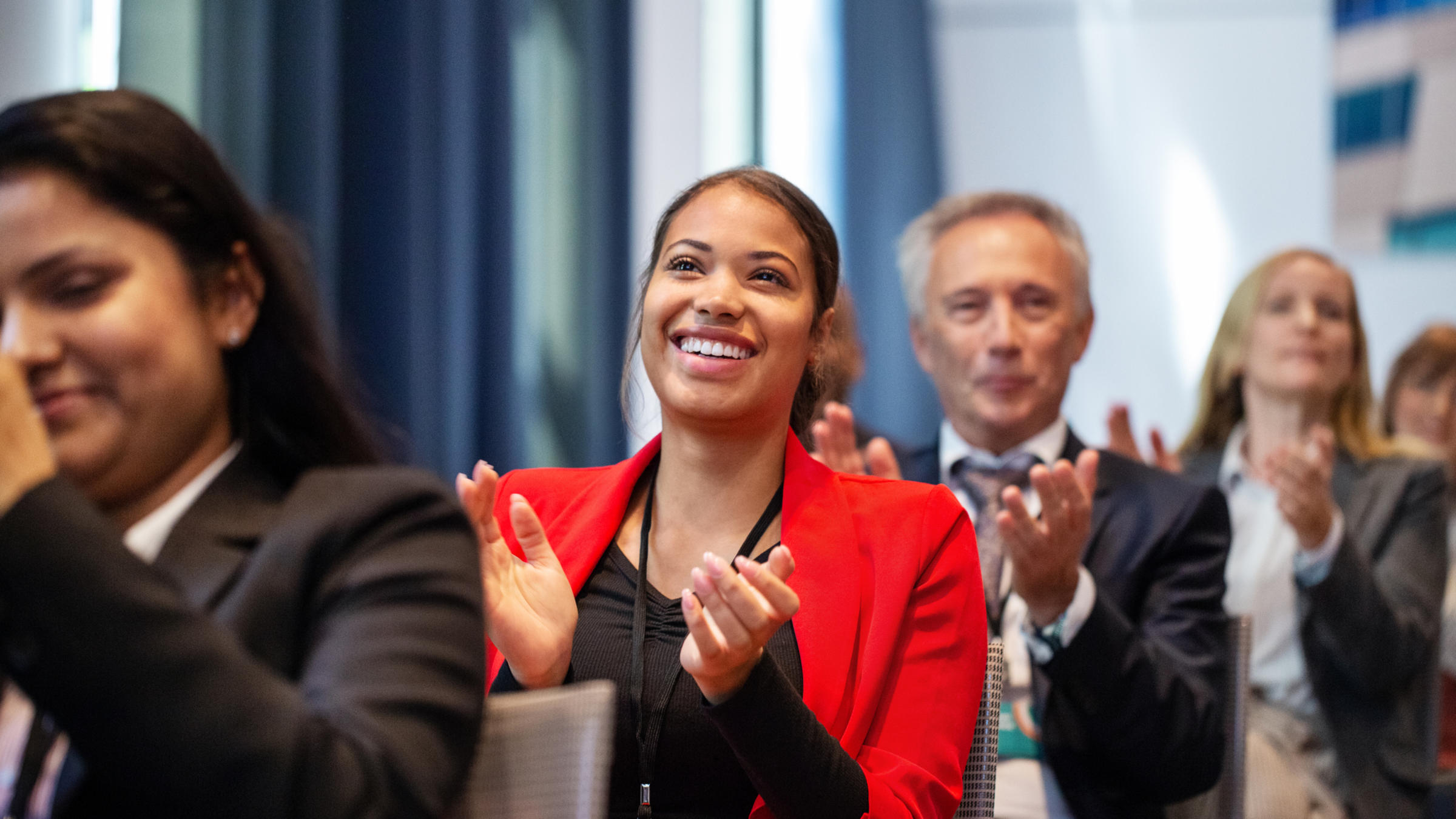 smiling business woman in red suit