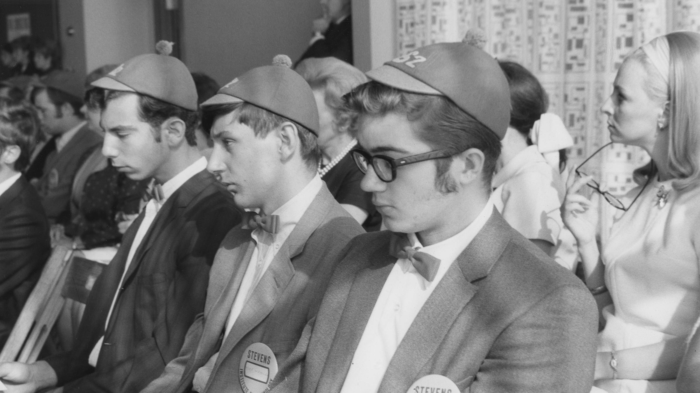 Black and white picture from the 1970s of Stevens students at convocation wearing dink hats.