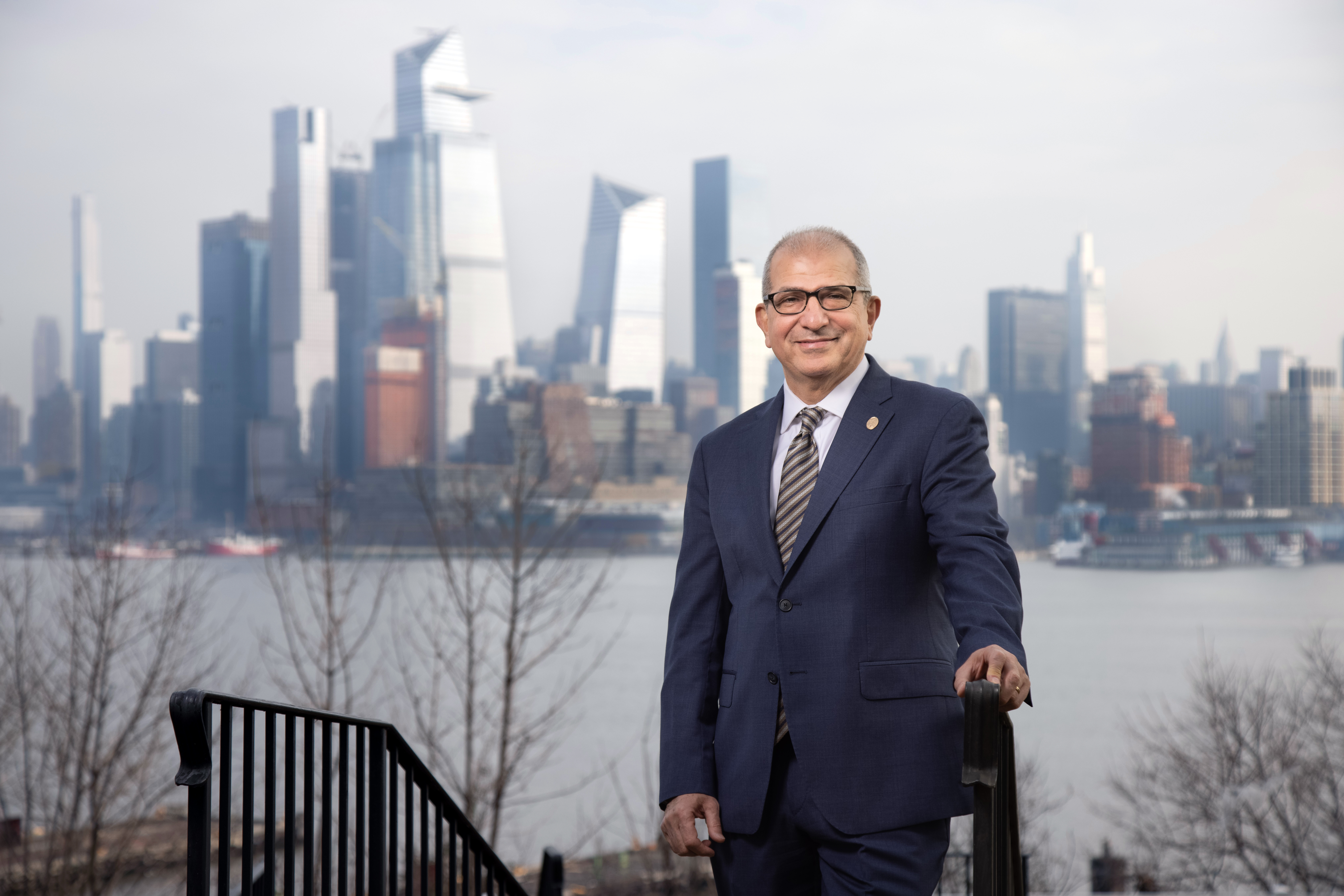 Stevens President Nariman Farvardin in front of the New York City skyline.