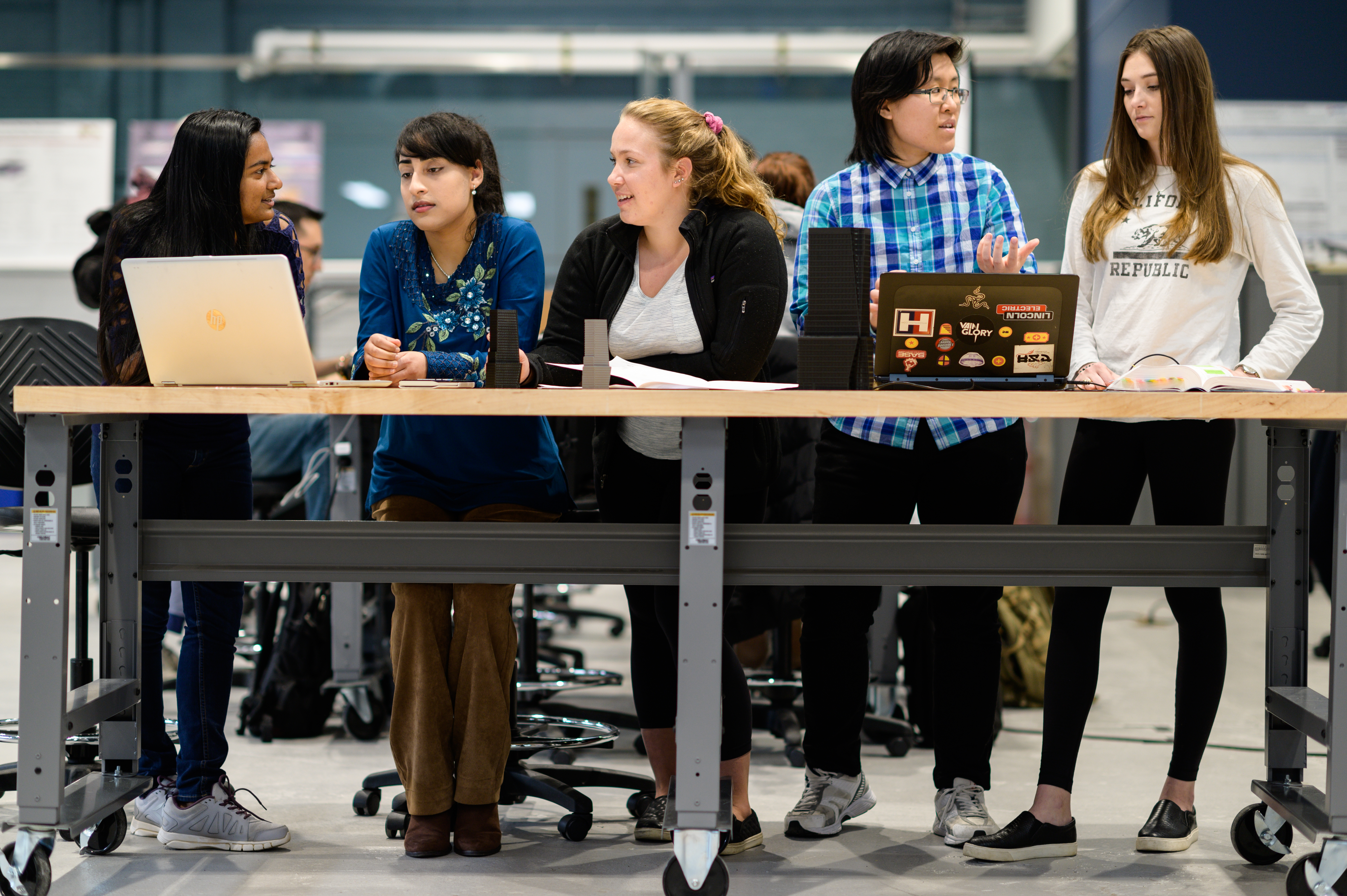 Group of female students collaborating in lab