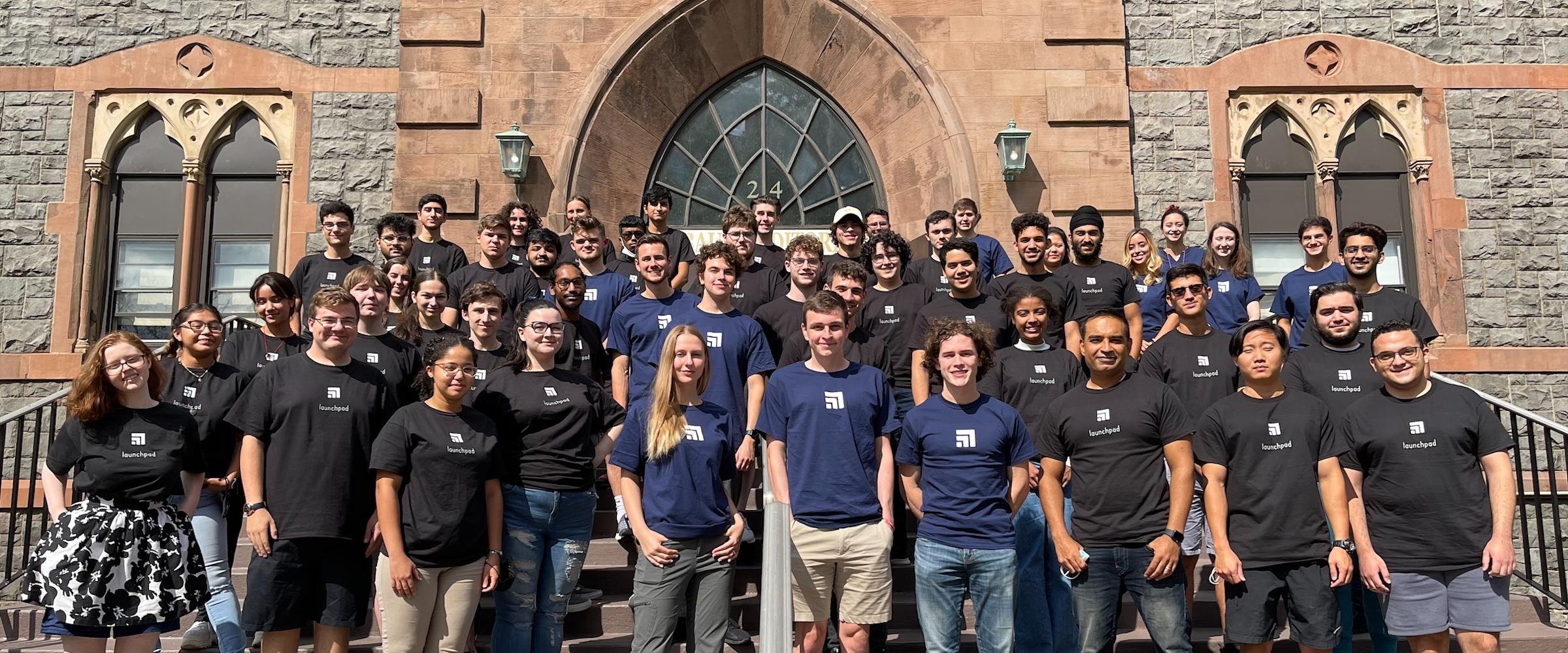 Group of Launchpad students and mentor pose on the steps of the Edwin A. Stevens Building