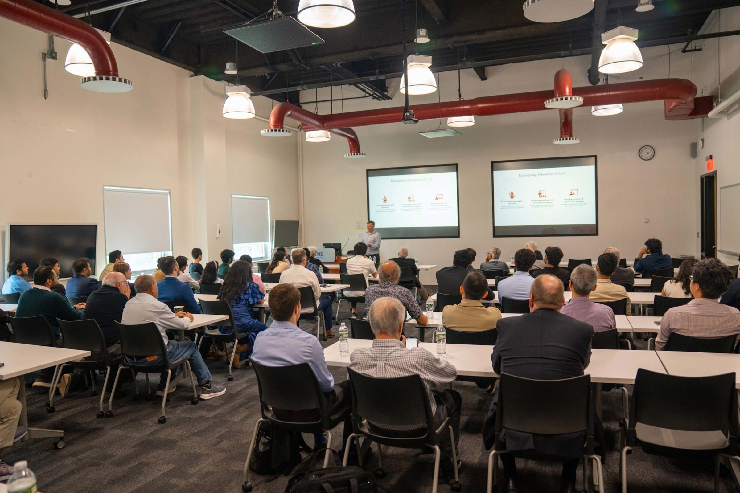Professor Alkiviadis Vazacopoulos presents his keynote to a packed classroom