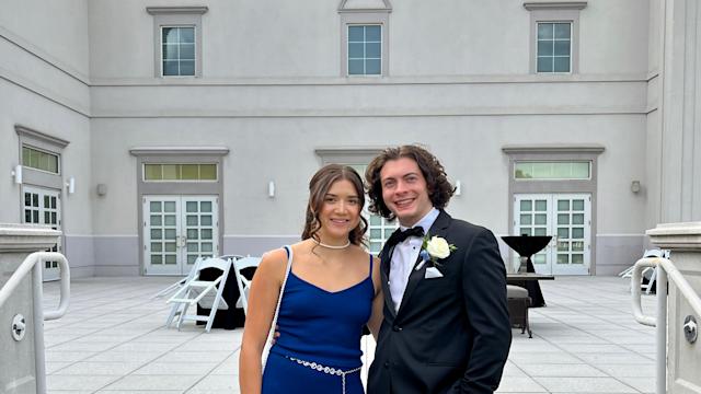 Keenan Yates ’24 and Thomas Obiedzinski ’24 pose for a photo together on steps outside in formal wear