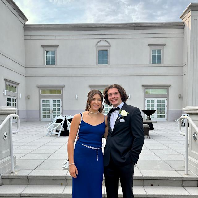 Keenan Yates ’24 and Thomas Obiedzinski ’24 pose for a photo together on steps outside in formal wear