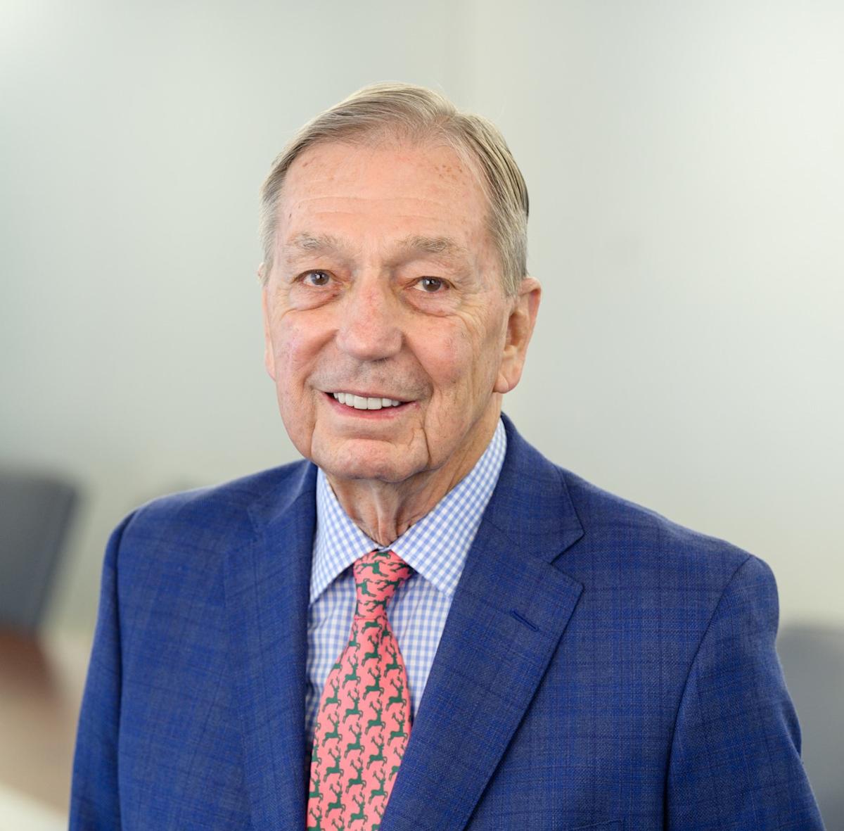 Michael Kakos in a conference room