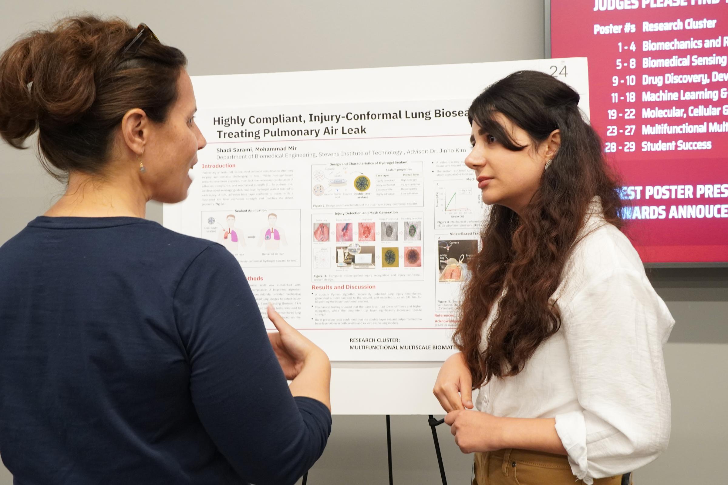 Professor Carrie Perlman (left) talking with student researcher Shadi Sarami.