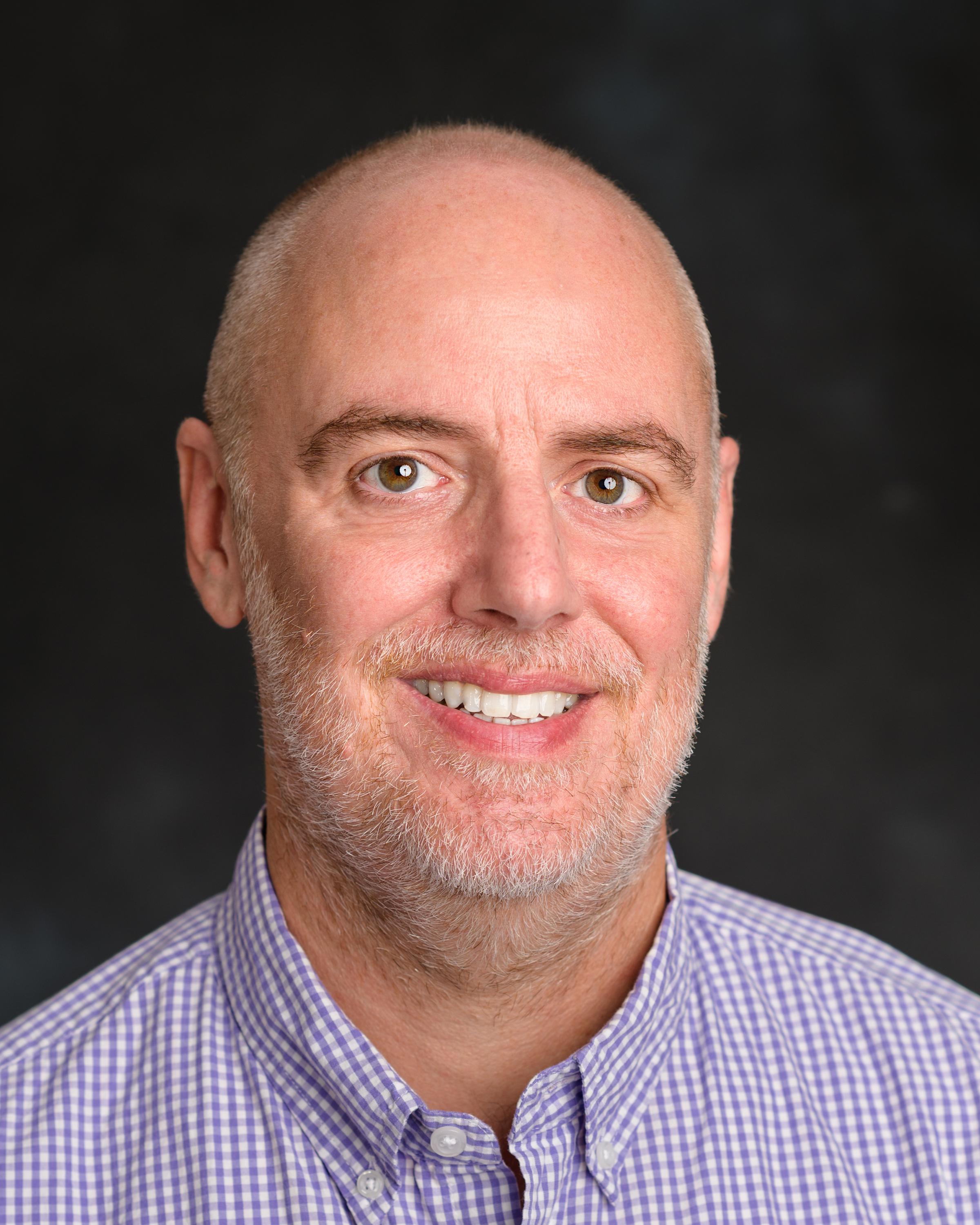 A headshot of Jay Boucher, our Senior Graphics Designer