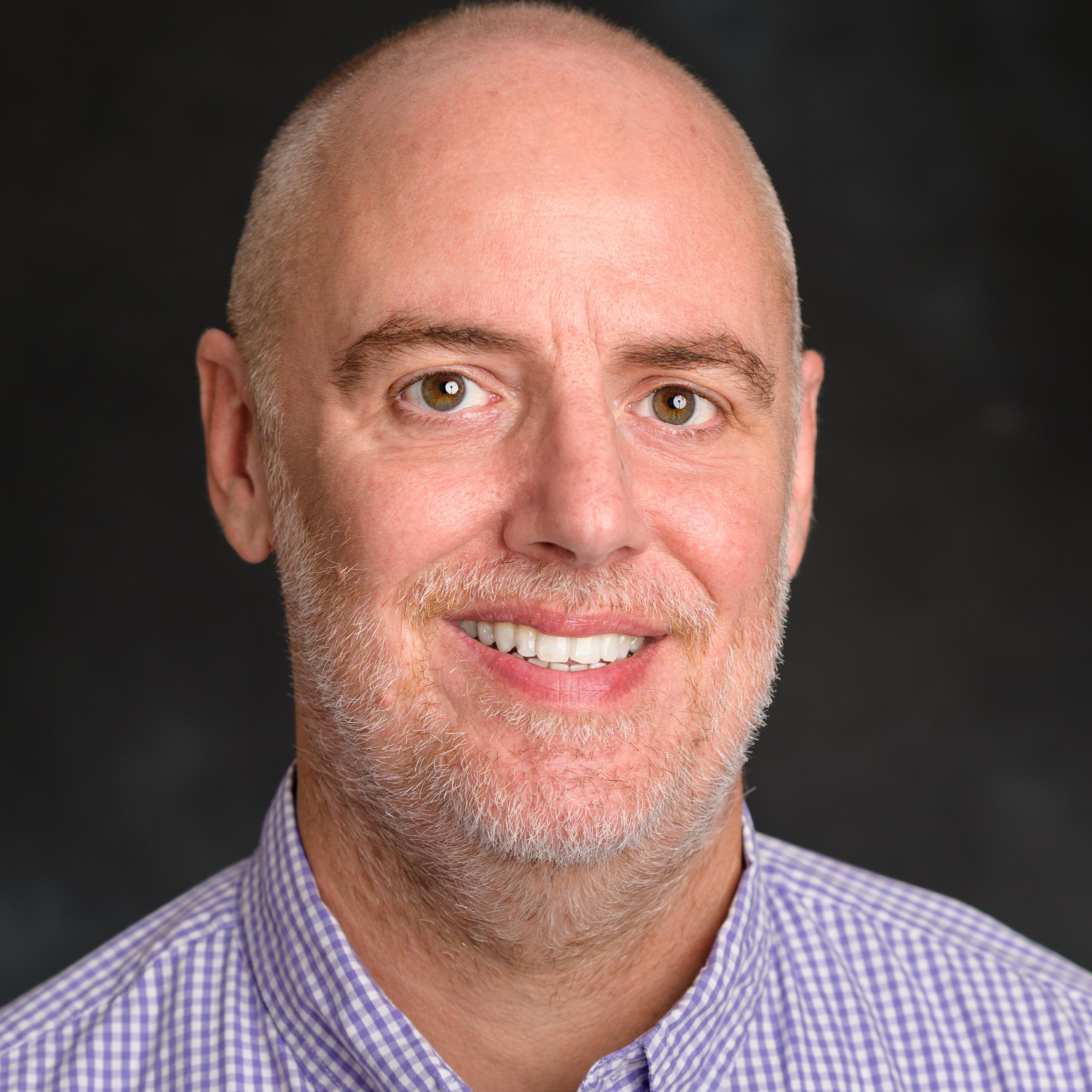 A headshot of Jay Boucher, our Senior Graphics Designer