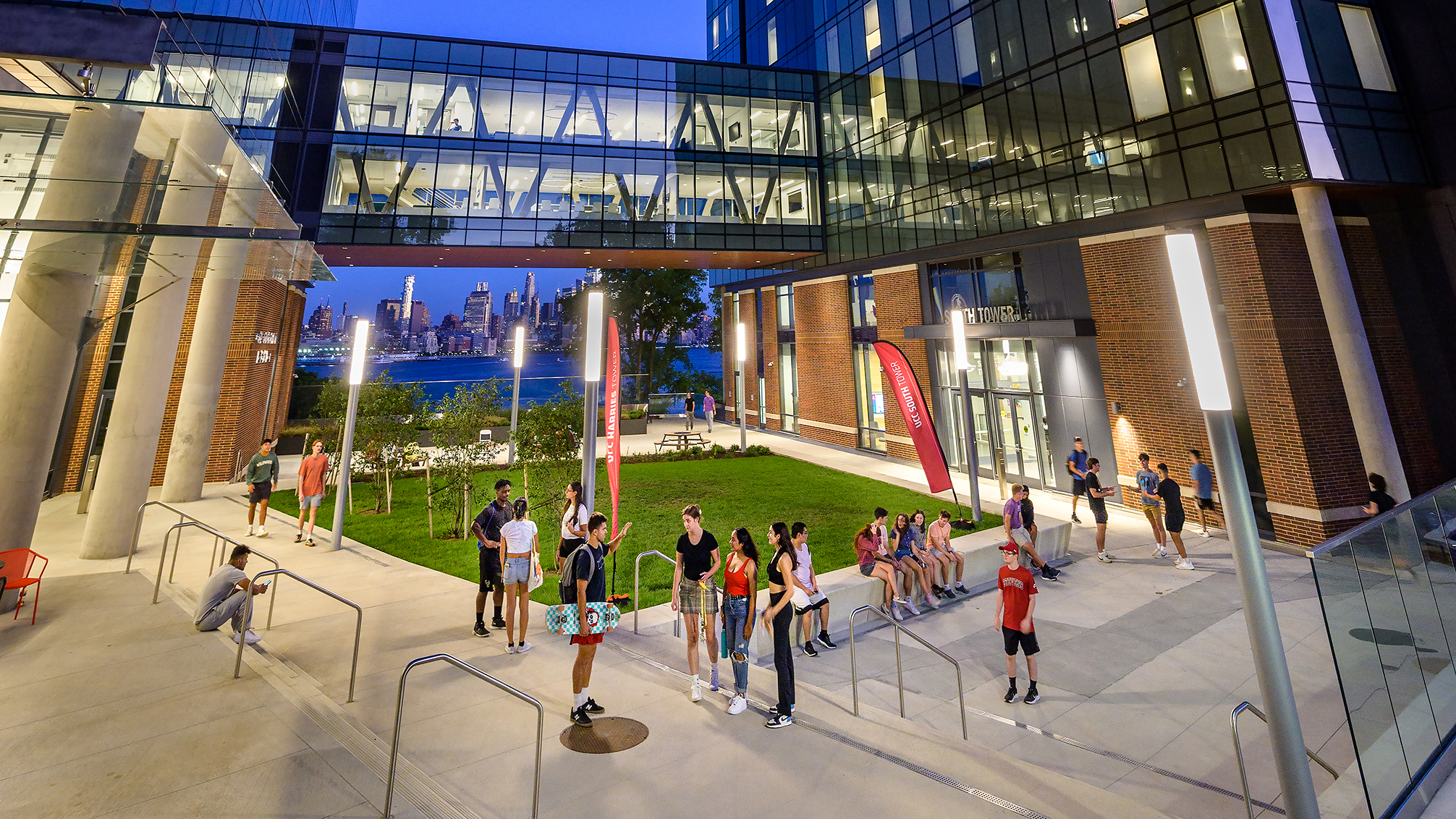 UCC towers outside with students socializing below