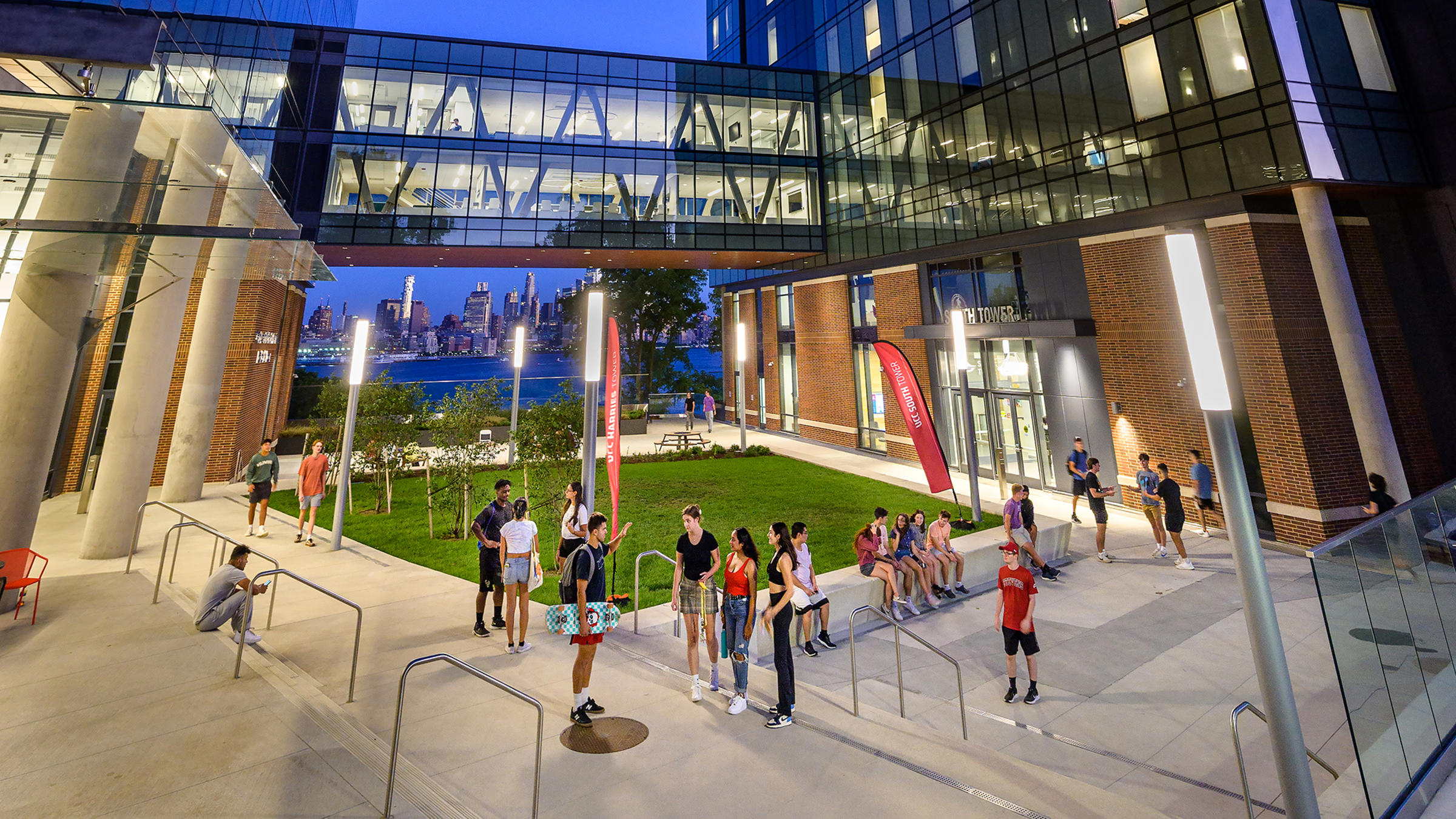 UCC towers outside with students socializing below