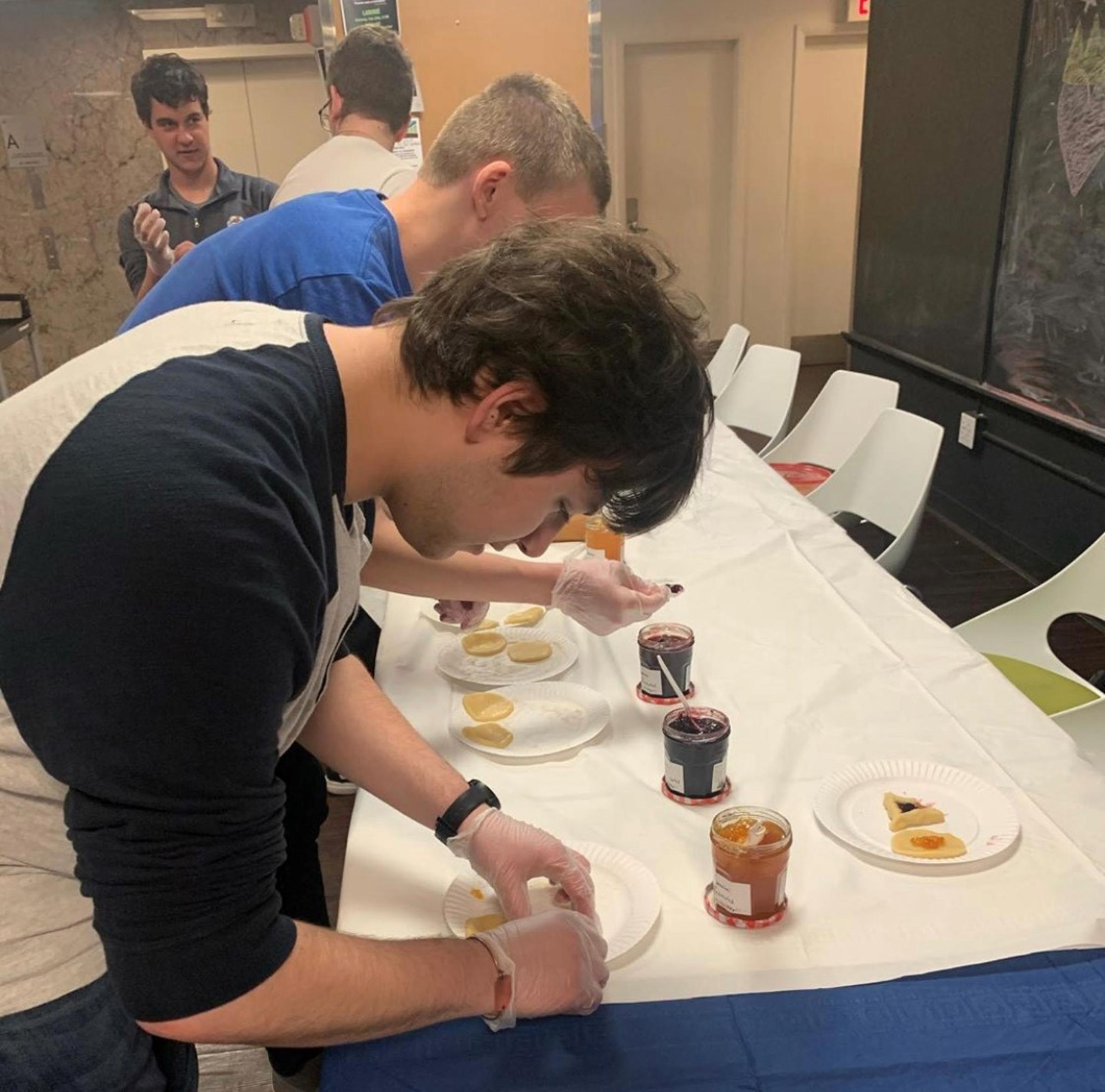 Male student making Hamentashen