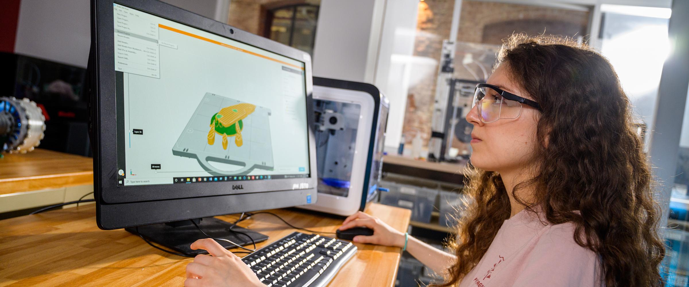 student in lab working on the computer