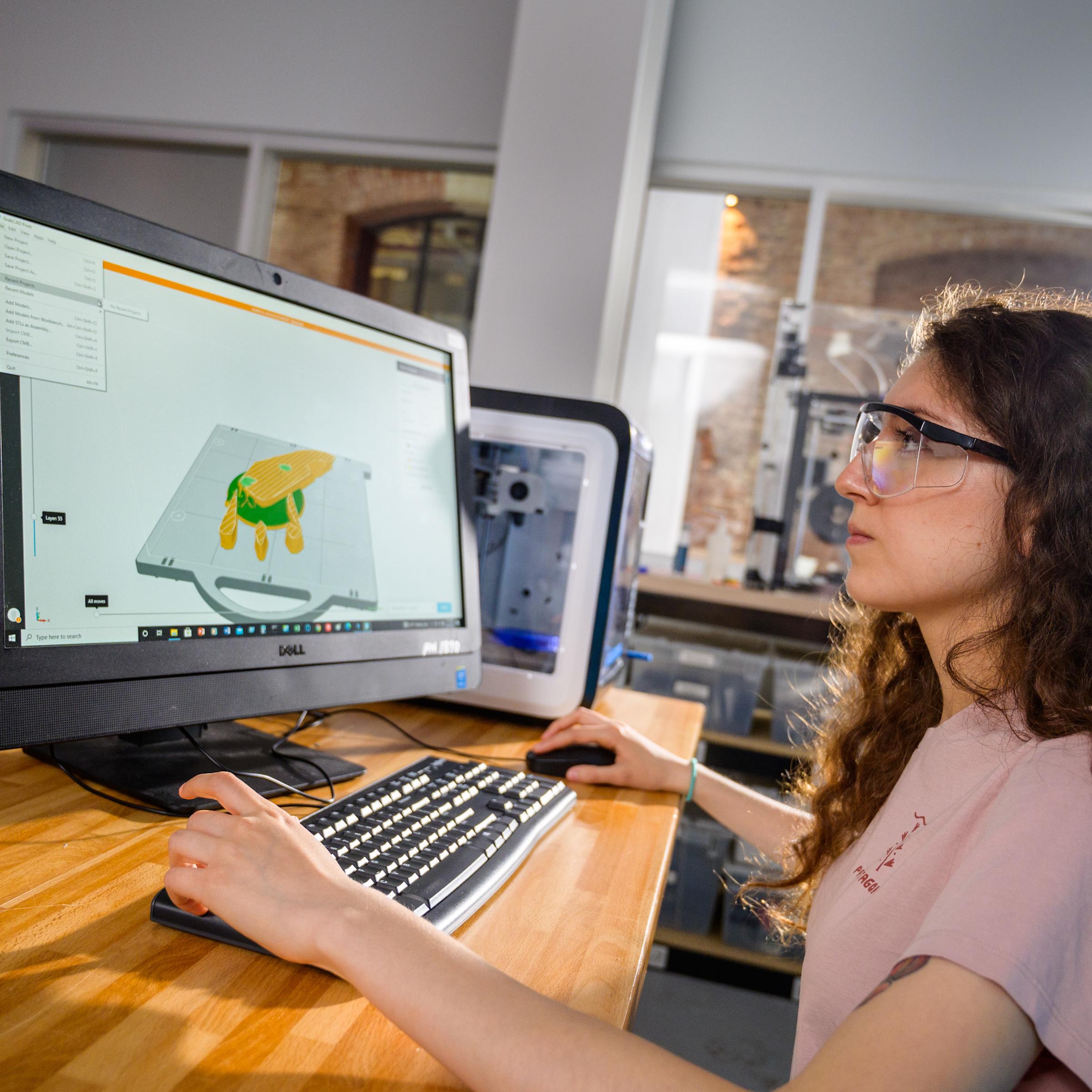 student in lab working on the computer