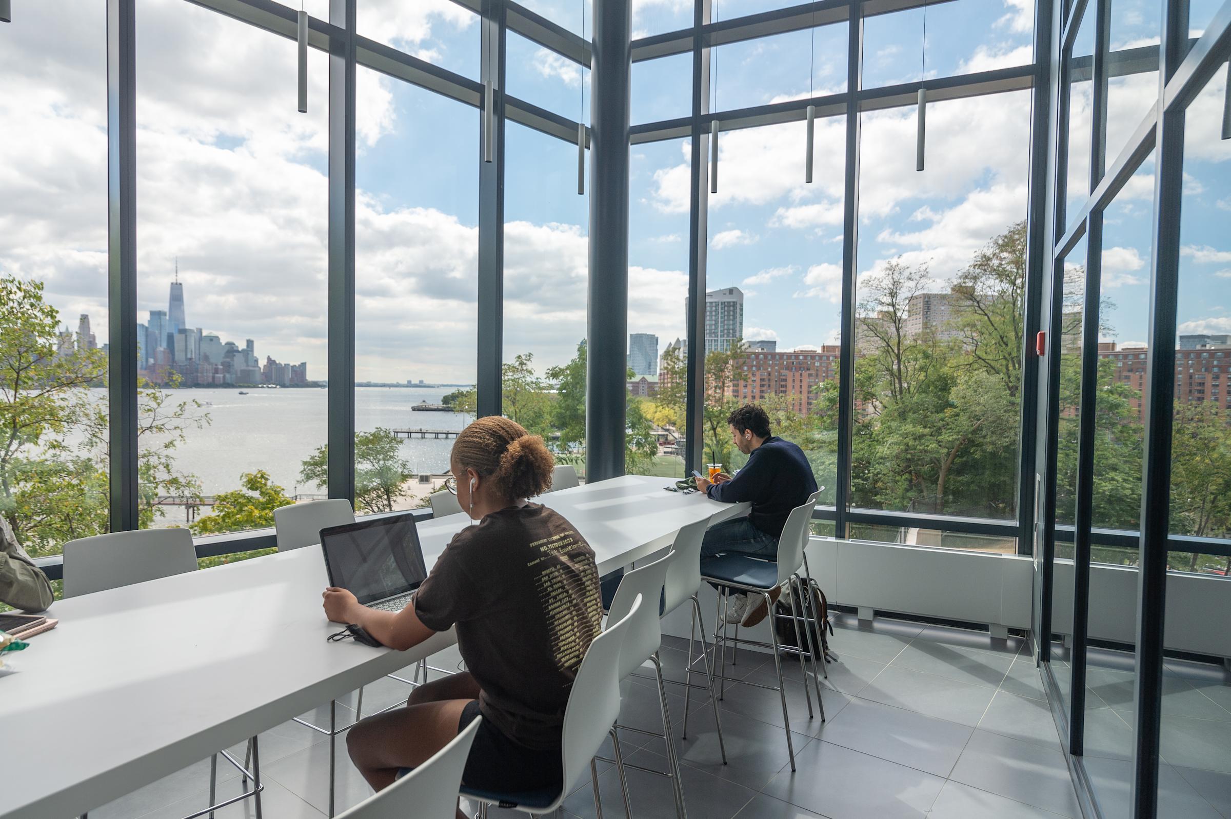 Students working in an open atrium
