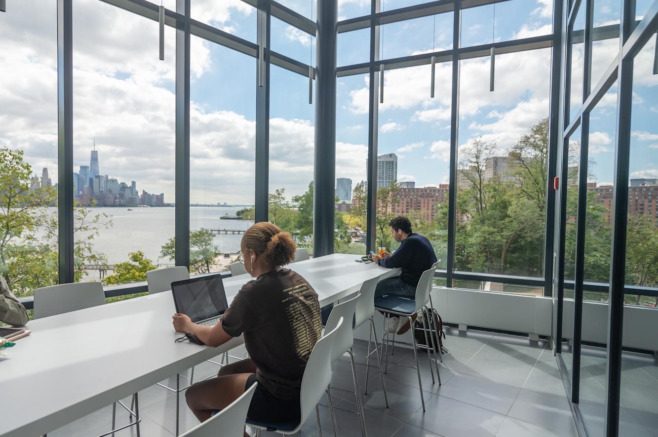 Students working in an open atrium