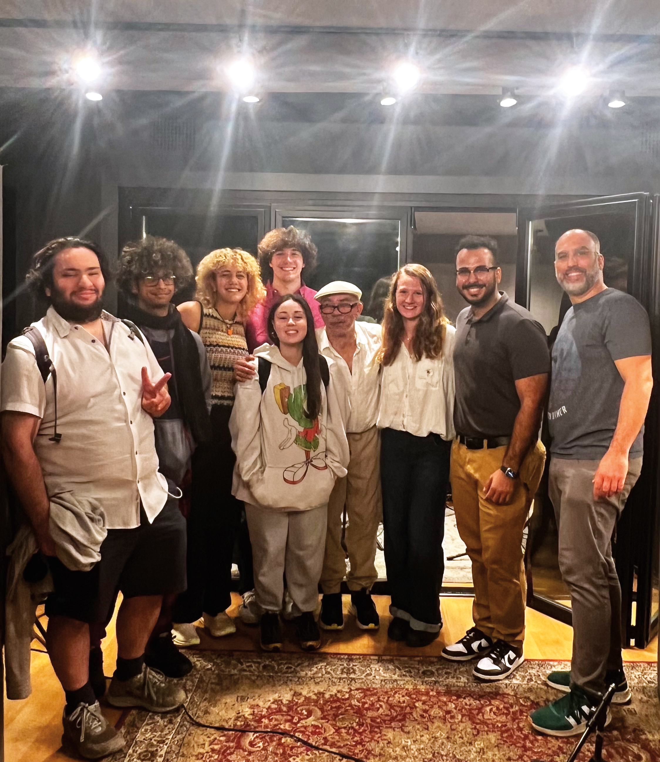 Afro-Latin jazz musician Abraham Rodriguez Jr., center, with Stevens students, from left, Teddy Diamond, Ashton Hummler, Sophia Zahran, Conlan Hurley, Valentina Vasquez, Anna Smith, Aidan Munoz, prof Michael Flannery, at Second Take Sound studio in NYC. 