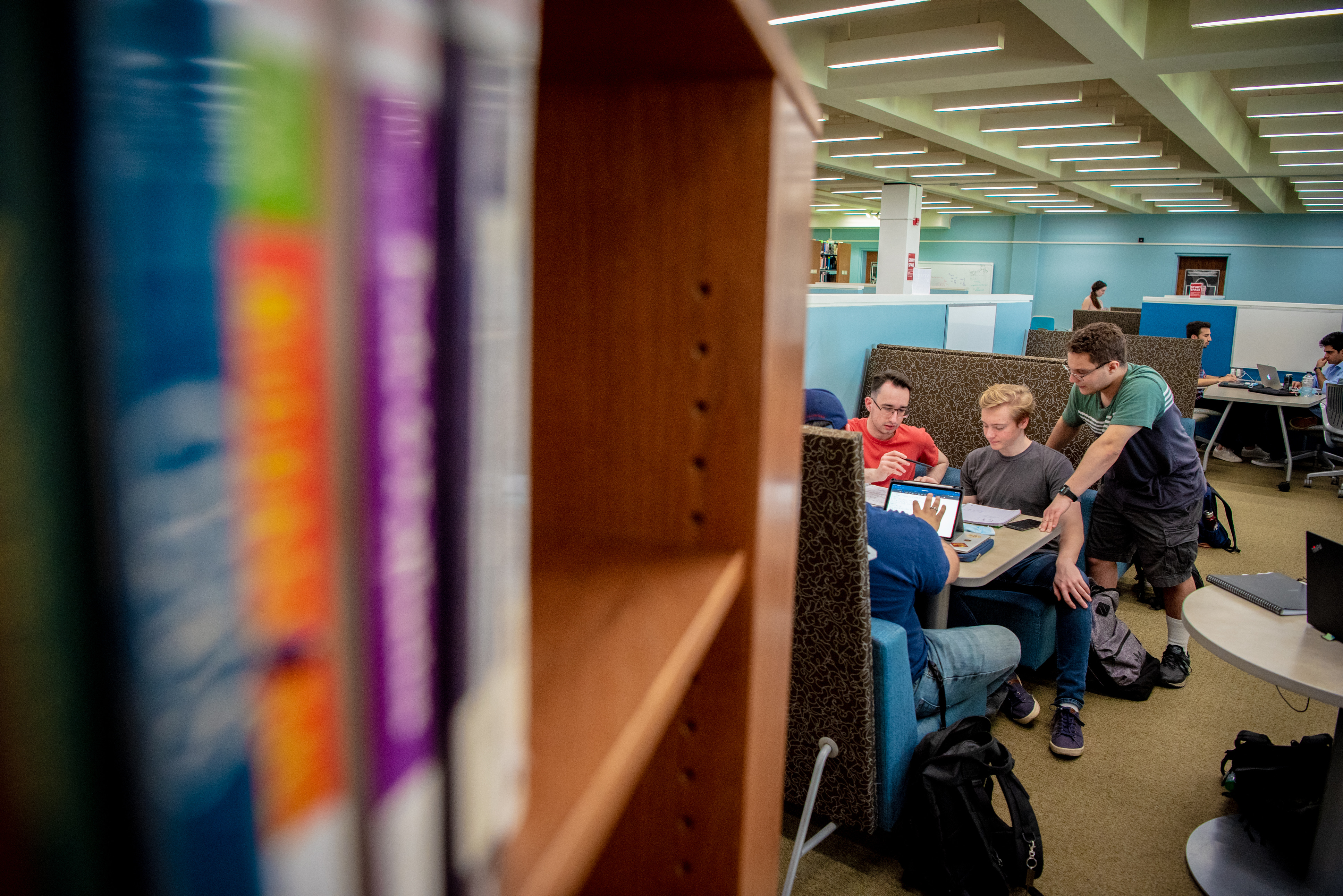 Students working at a table in the library.
