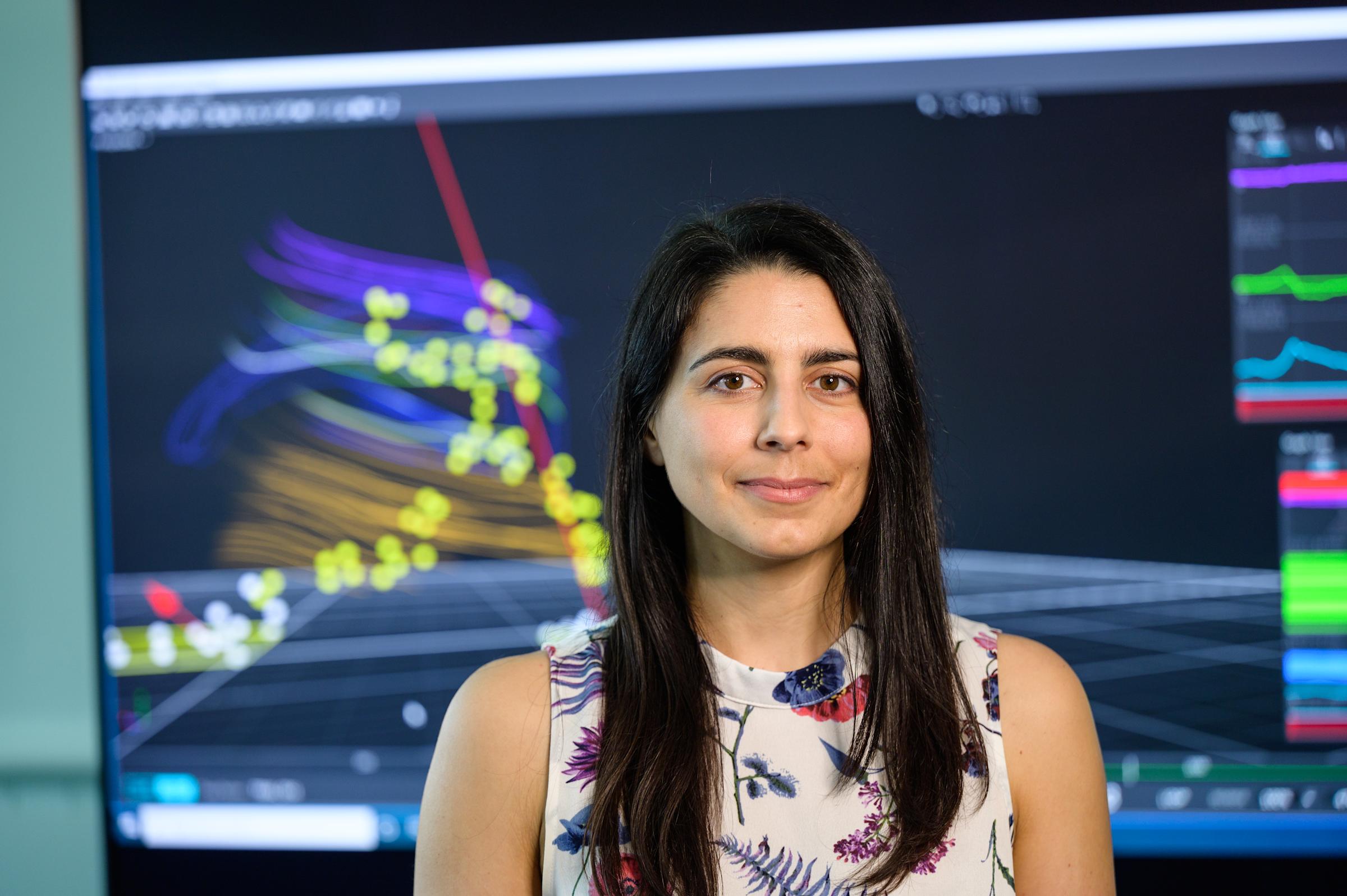 Professor Antonia Zaferiou in front of a computer screen in her Stevens lab