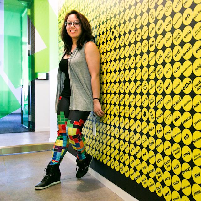 Caroline Amaba standing against a wall at Buzzfeed headquarters