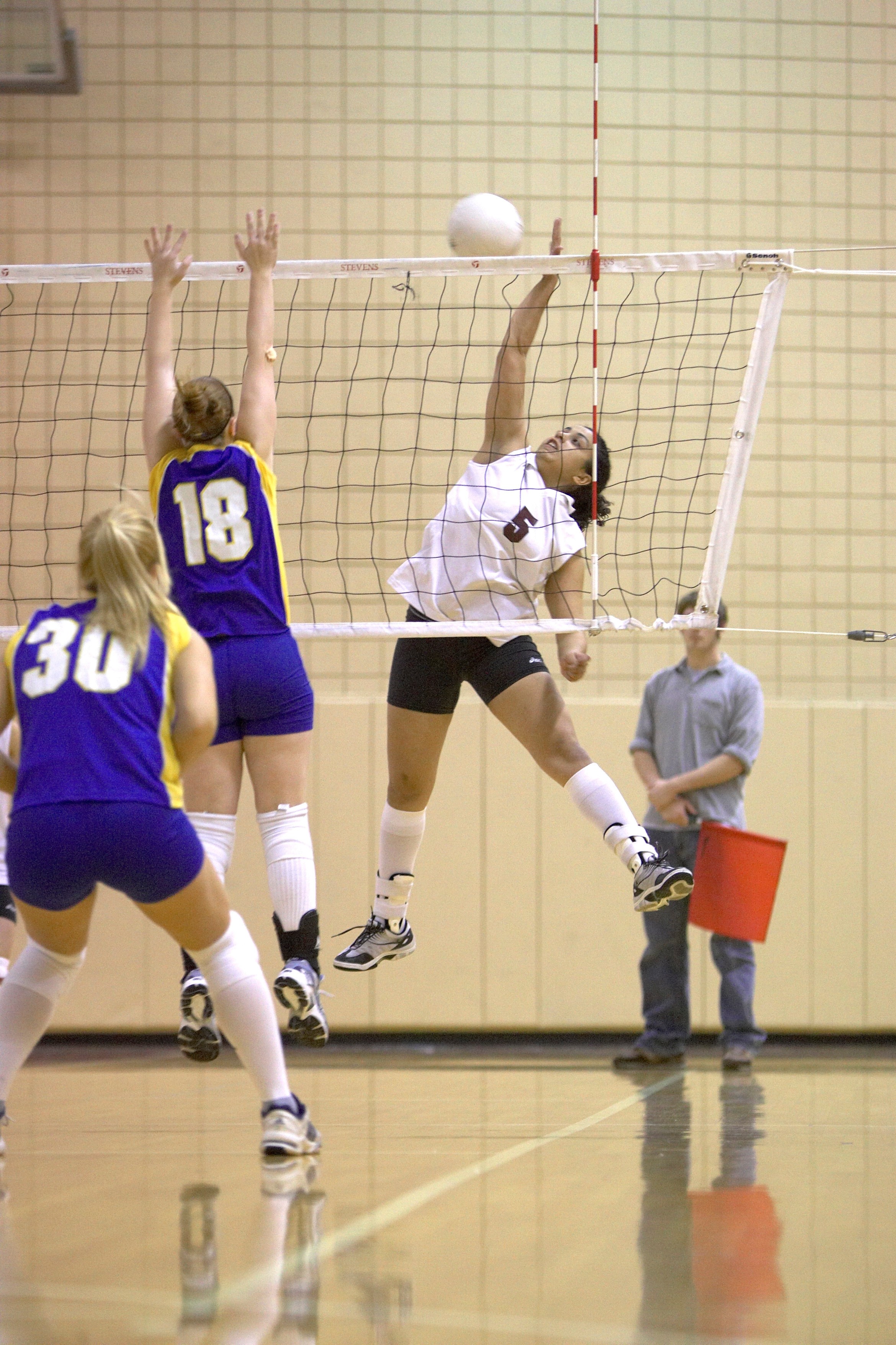 Students playing volleyball 
