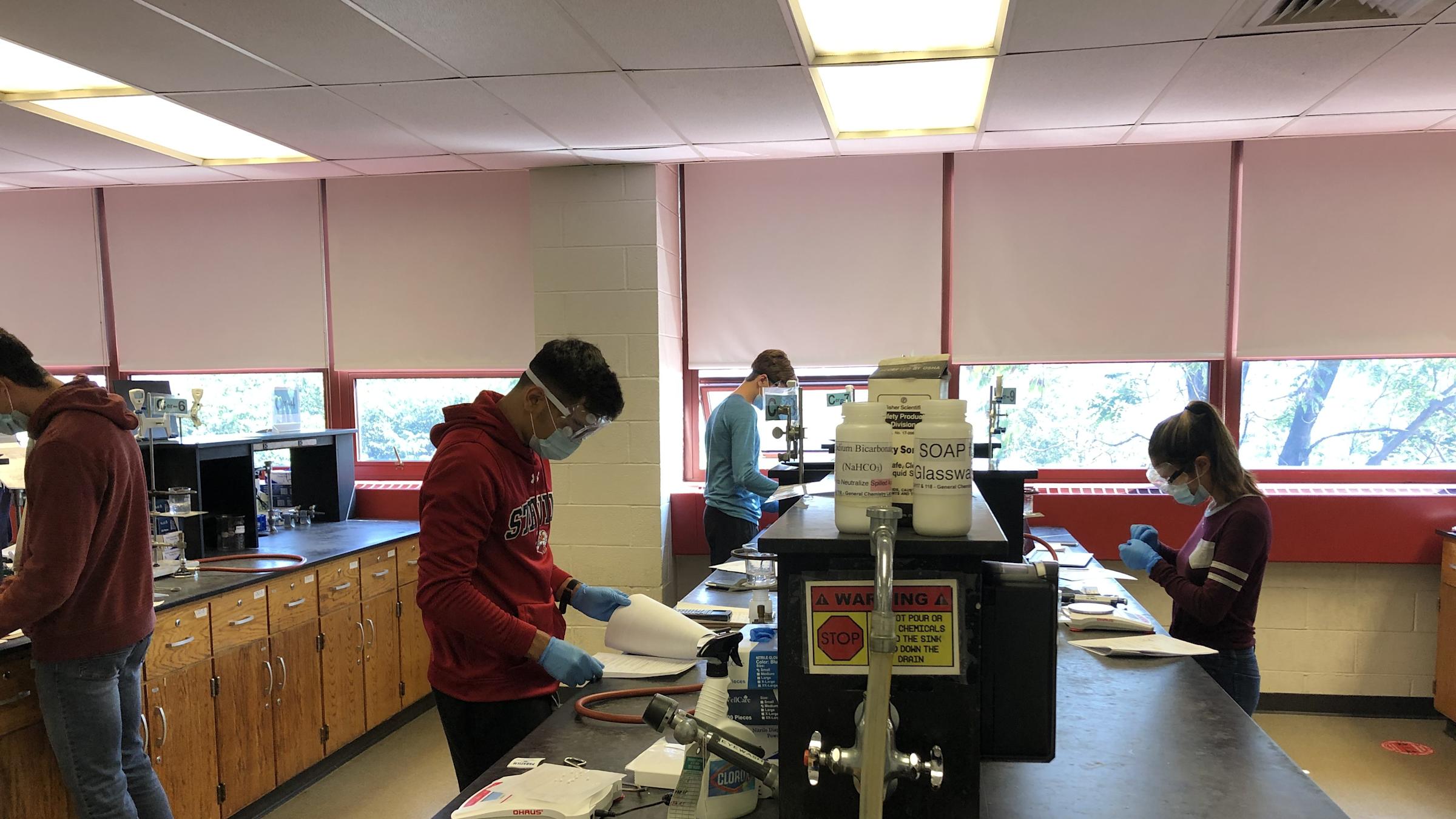 photo of students wearing PPE in the lab