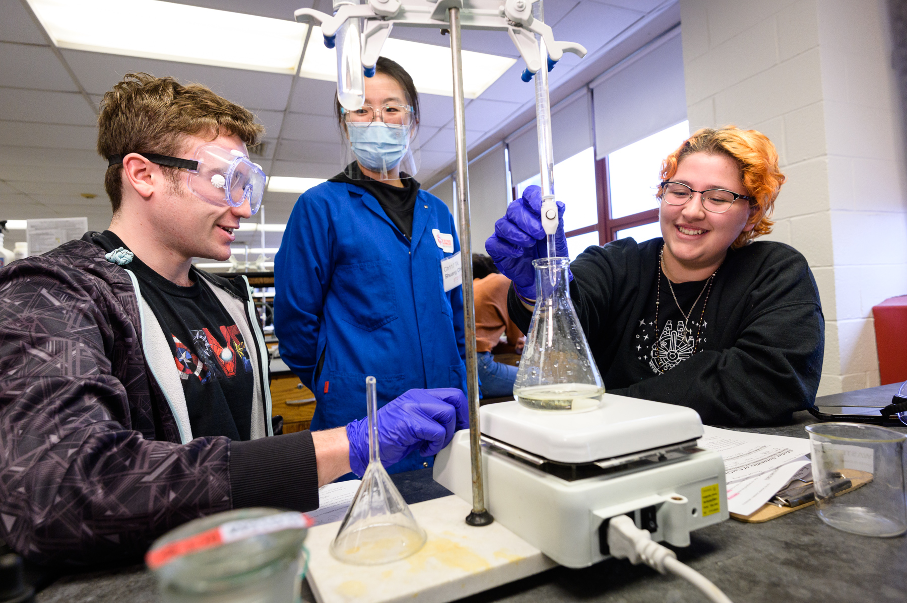 Chemistry and Chemical Biology students work with lab equipment.