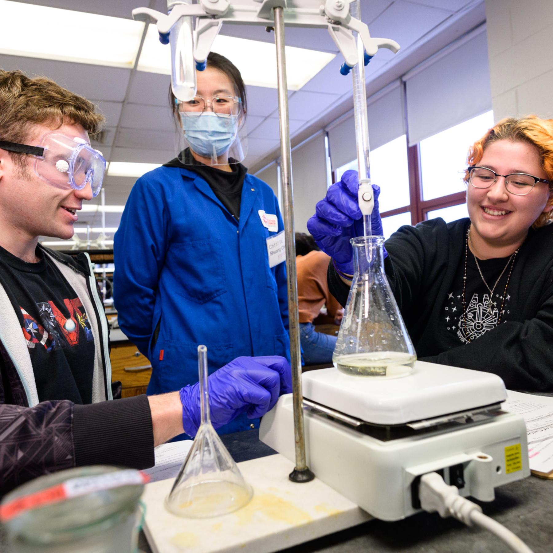 Chemistry and Chemical Biology students work with lab equipment.