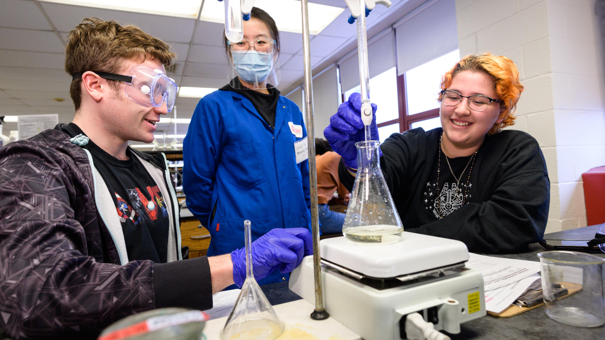 Chemistry and Chemical Biology students work with lab equipment.