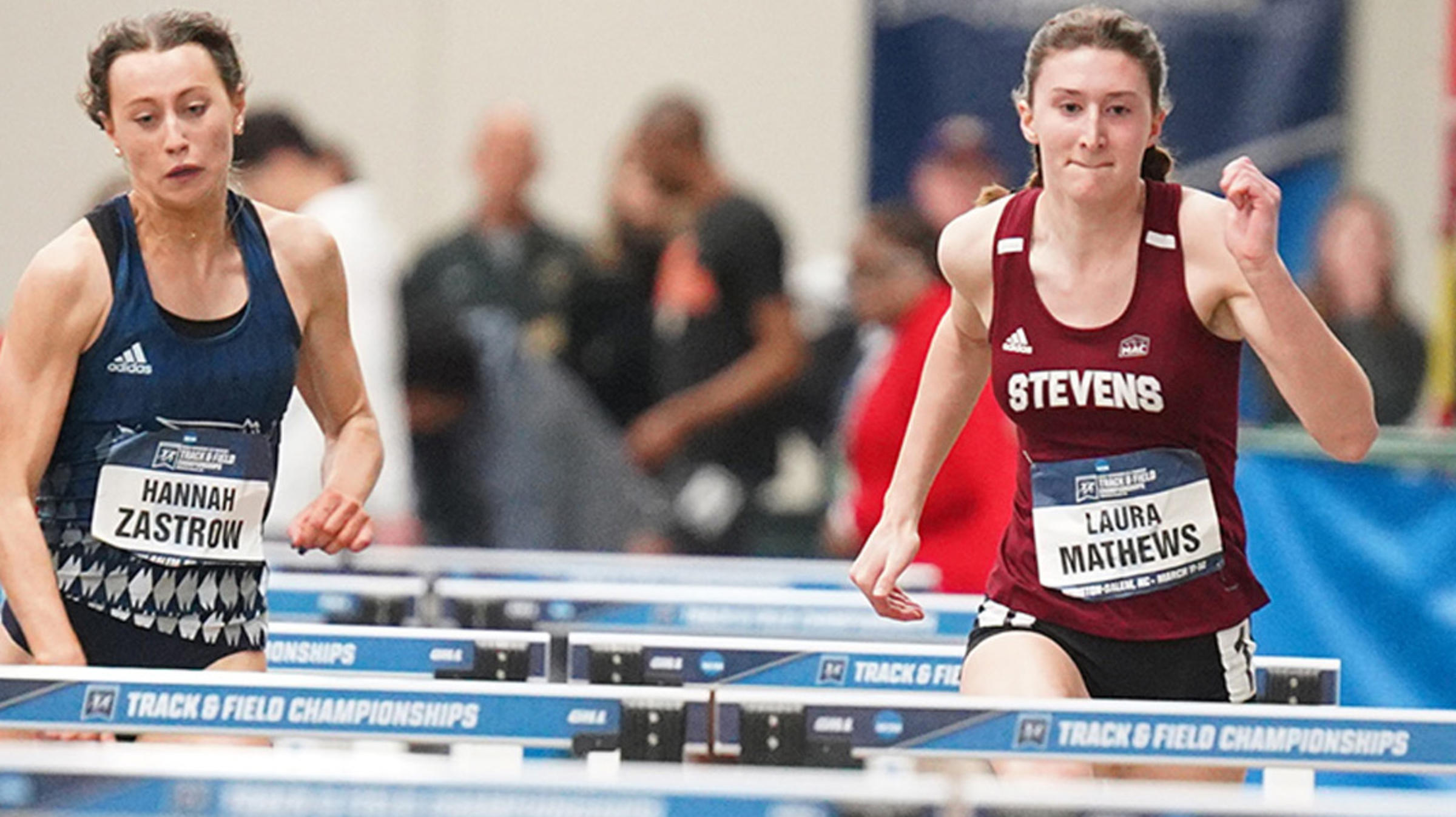 Laura Mathews competing in indoor hurdles.
