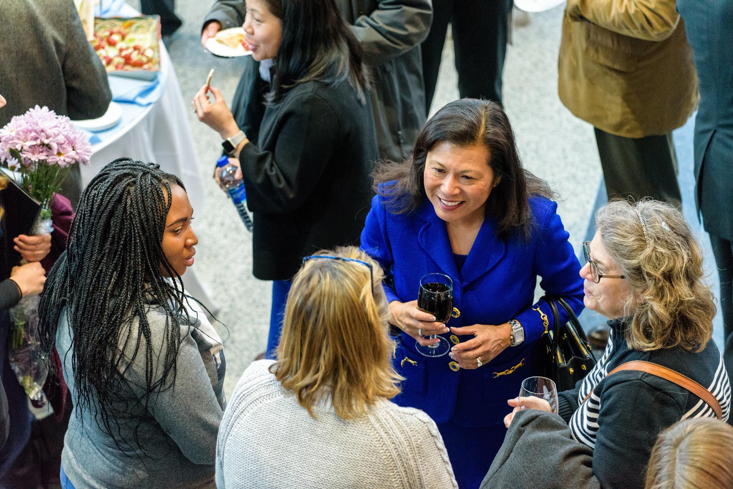 Lecture attendees network with Dr. Mariano